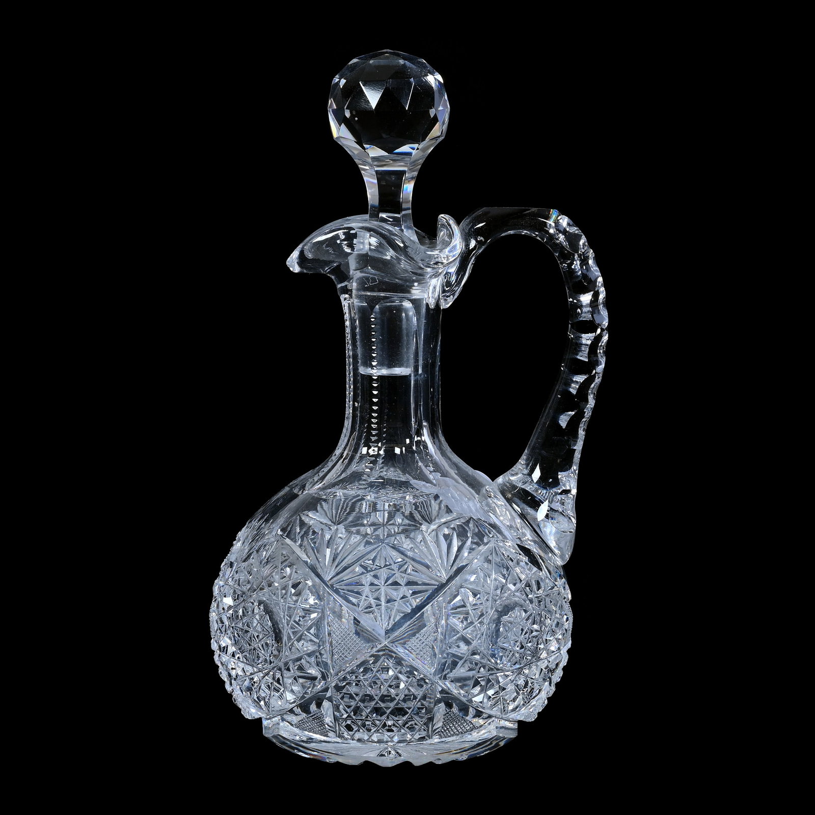 Cruet, American Brilliant Cut Glass, Hobstar, Nailhead Diamond And Fan Motif: Cruet, American Brilliant Cut Glass, Hobstar, Nailhead Diamond And Fan Motif, 7" x 4", Ray Cut Base, Double Notched Handle, Estate of Paul Pellet, Texas.