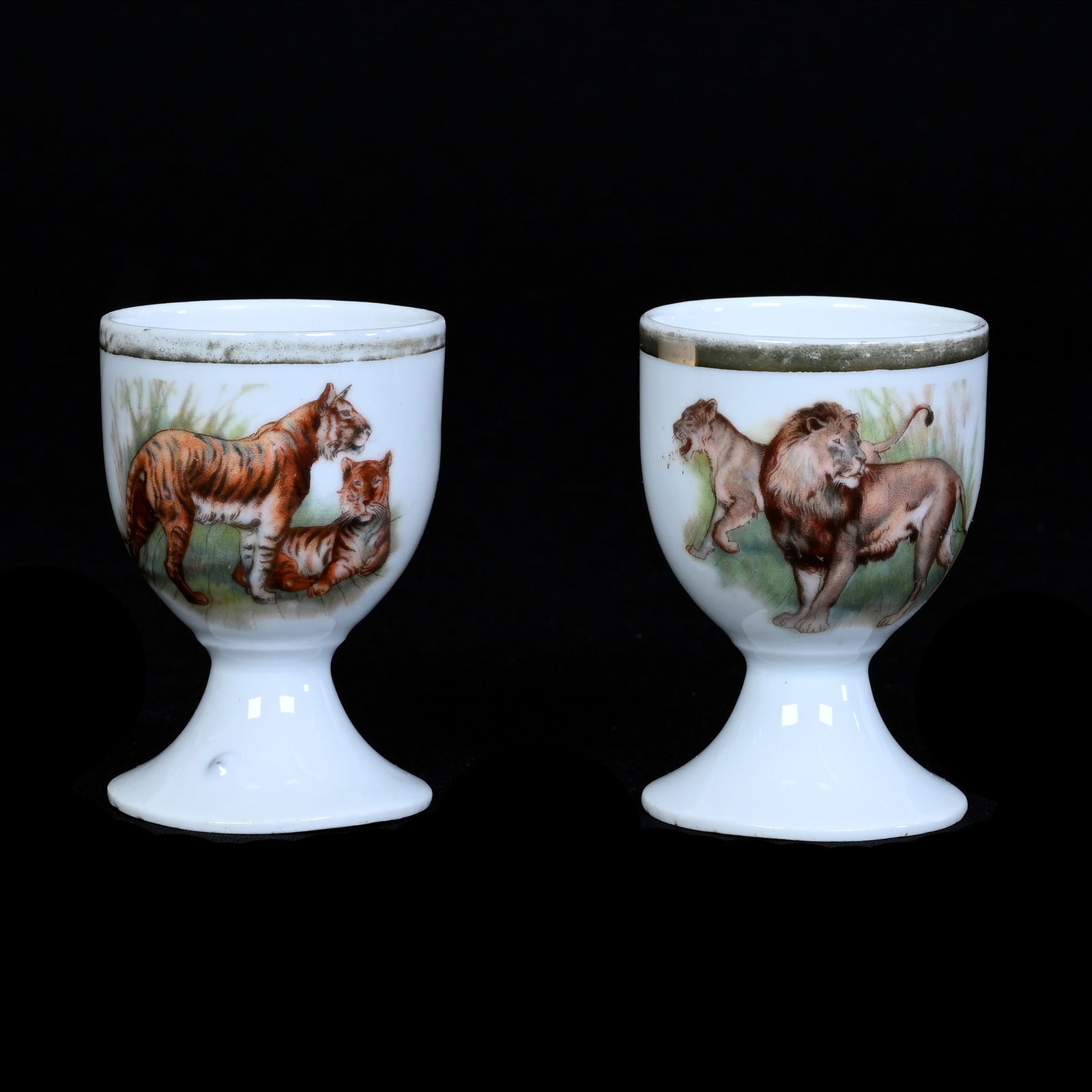 Pair Egg Cups, Unmarked Germany, Rare Tiger And Lion Scenic Decors: Pair Egg Cups, Unmarked Germany, Rare Tiger And Lion Scenic Decors, 2.5" x 1.75", White Background, Illinois Private Collection.