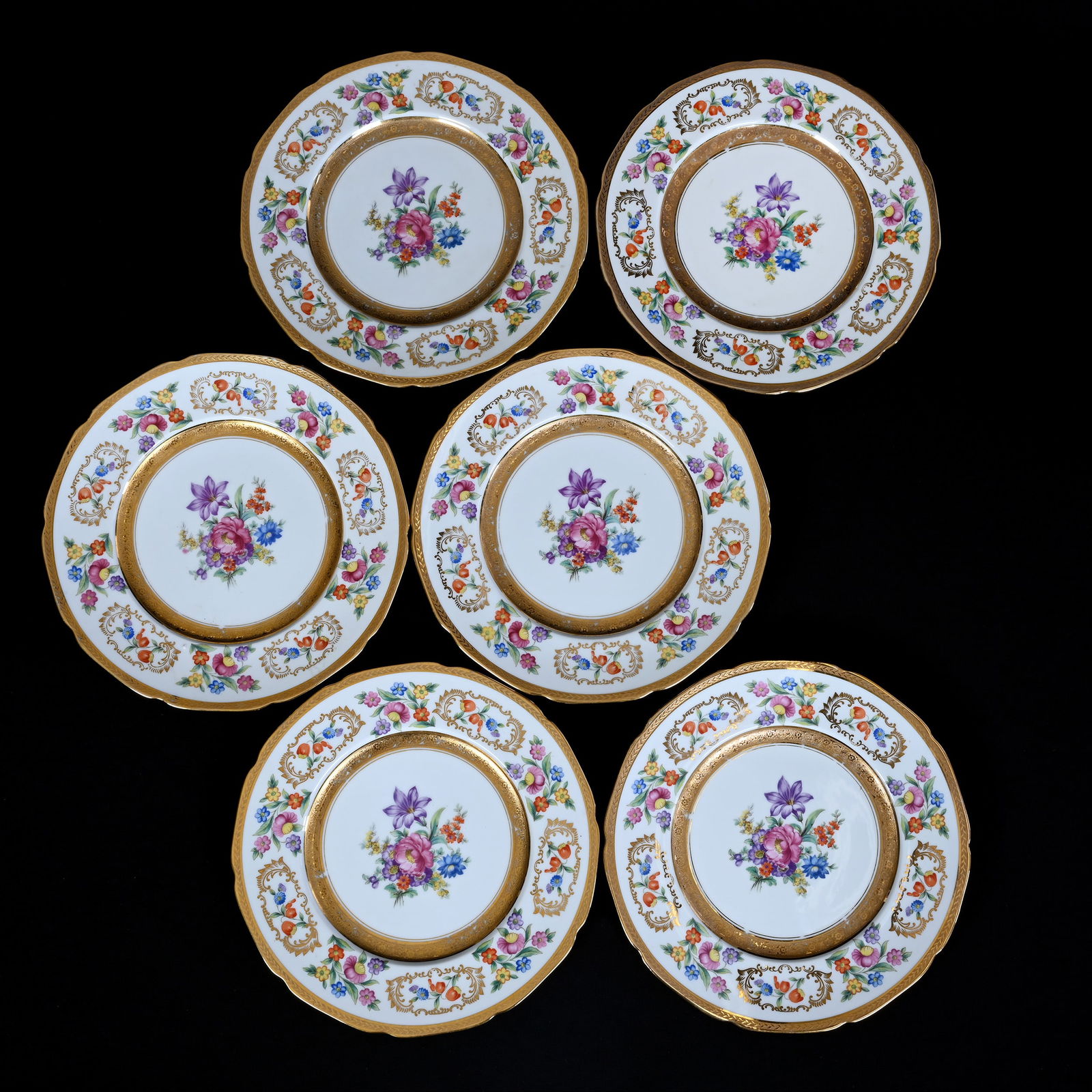 (6) Plates Marked Meito Japan: (6) Plates Marked Meito Japan, 10.75", White With Colorful Floral Decor And 22K Gold Border, Illinois Private Collection.