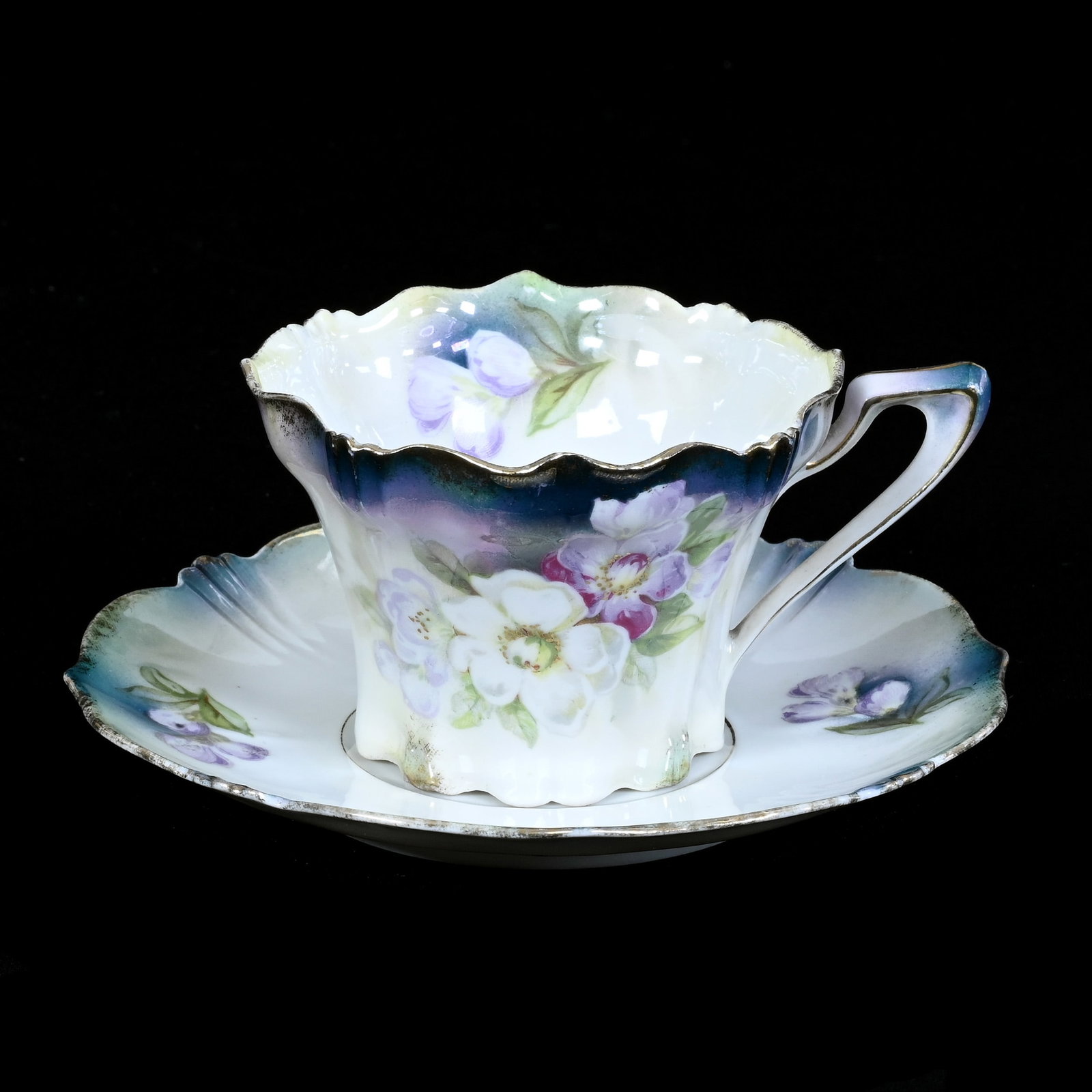 Coffee Cup And Saucer Marked R.S. Prussia: Coffee Cup And Saucer Marked R.S. Prussia, 2.75" x 5.75", Blue, Lavender & White Luster Finish, Floral Decor, Hard To See Interior Rim Chip On Cup, Bob Crampton Collection, IL.