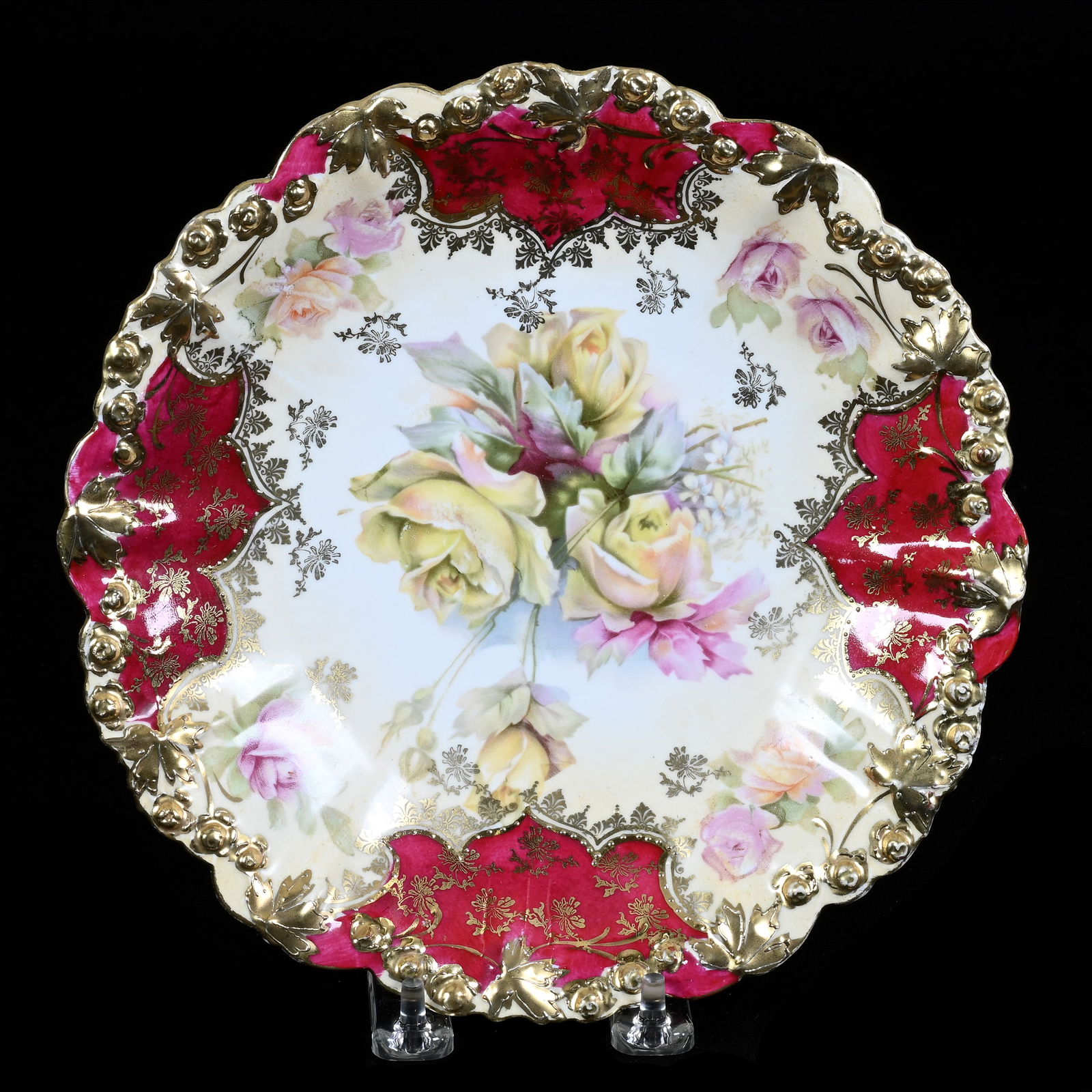 Plate, Unmarked R.S. Prussia, Rosebud Mold, Cream Tones, Red Border: Plate, Unmarked R.S. Prussia, Rosebud Mold, Cream Tones, Red Border, 9", Pink and Yellow Rose Decor, Extensive Gold Stencil Highlights, Neal and Barbara Smith Private Collection, Alabama.