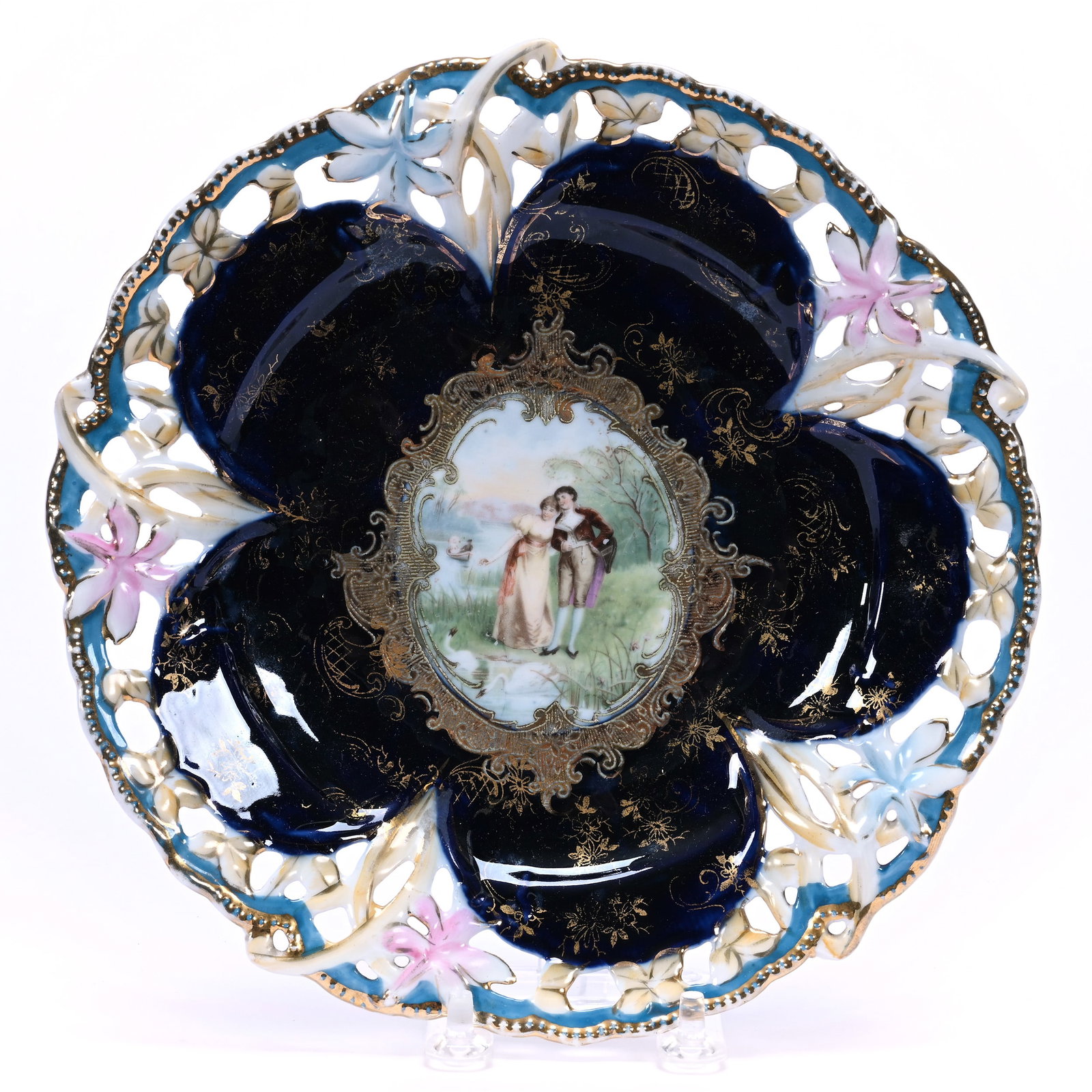 Plate, Unmarked Crown Versa, Cobalt Blue With Courting Scene Decor: Plate, Unmarked Crown Versa, Cobalt Blue With Courting Scene Decor, 8.5", Reticulated Border, Christine And The Late Bob Welter Collection, Texas.