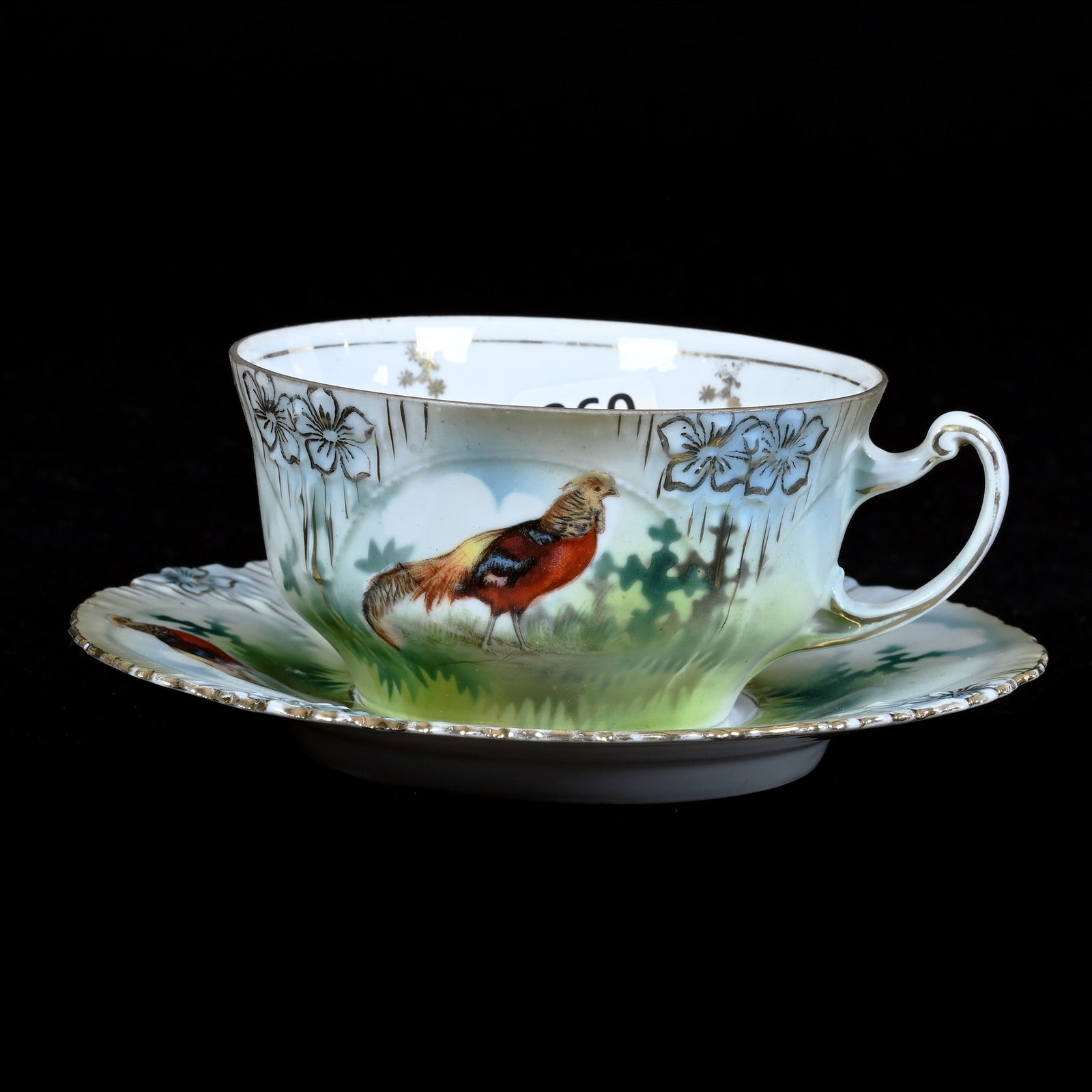 Coffee Cup and Saucer, Marked R.S. Prussia, Icicle Mold, Pheasant Scenic Decor: Coffee Cup and Saucer, Marked R.S. Prussia, Icicle Mold, Pheasant Scenic Decor, 2.25" x 5.5", Neal and Barbara Smith Private Collection, Alabama.