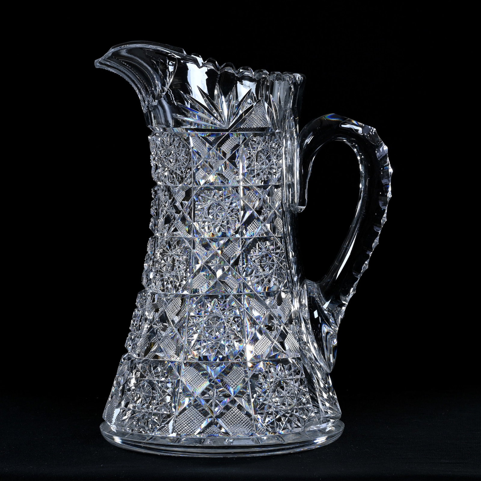 Water Pitcher, American Brilliant Cut Glass, Arcadia Type Pattern: Water Pitcher, American Brilliant Cut Glass, Arcadia Type Pattern, 10.5" x 7.75", Triple Notched Handle, Ray Cut Base, Spout Has Been Repaired, Eleanor Eulau Collection.
