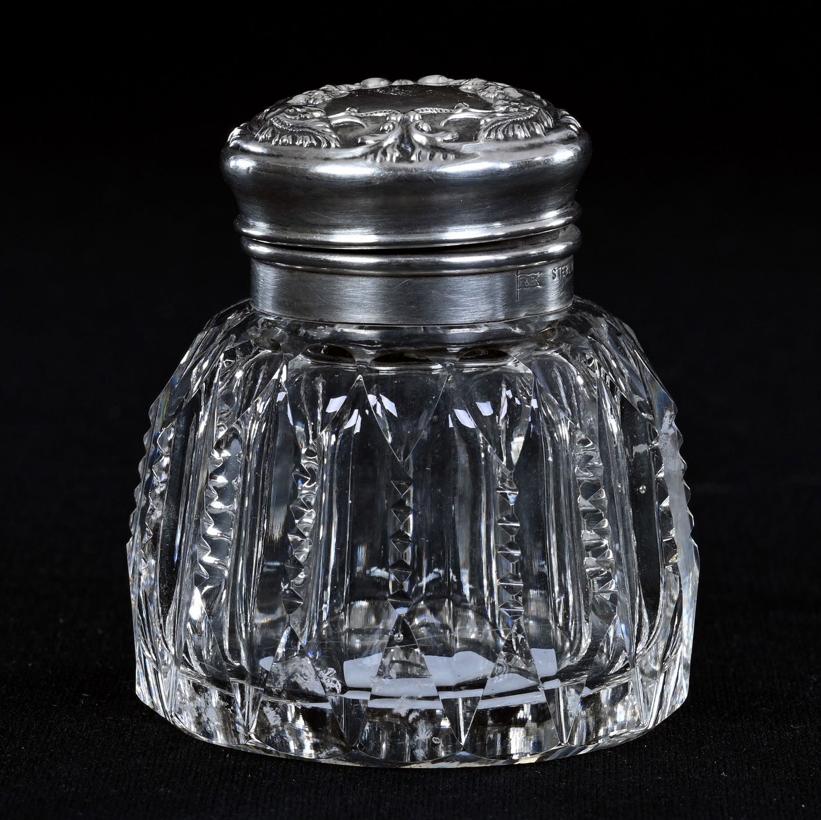 Inkwell, American Brilliant Cut Glass, Prism Cut Body, Sterling Silver Flip Lid: Inkwell, American Brilliant Cut Glass, Prism Cut Body, Sterling Silver Flip Lid, 2.5" x 2", Embossed Woman And Plume Design On Sterling Lid Marked Foster And Bailey, Eleanor Eulau Collection.