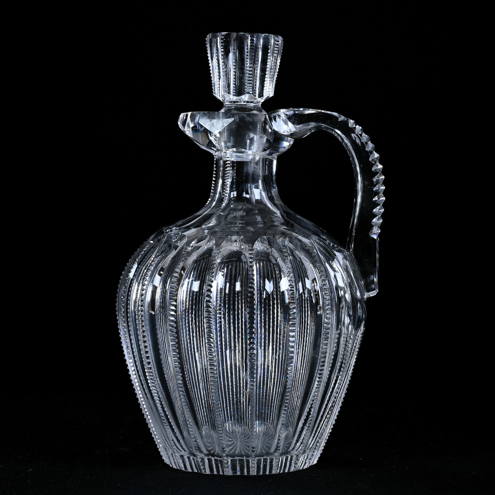 Whiskey Jug, American Brilliant Cut Glass, Flute And Zipper Design: Whiskey Jug, American Brilliant Cut Glass, Flute And Zipper Design, 8.5" x 5.25", Triple Notched Strap Handle, Ray Cut Base, Pattern Matched Stopper With Rim Chip, Spout Nick, California Private Colle