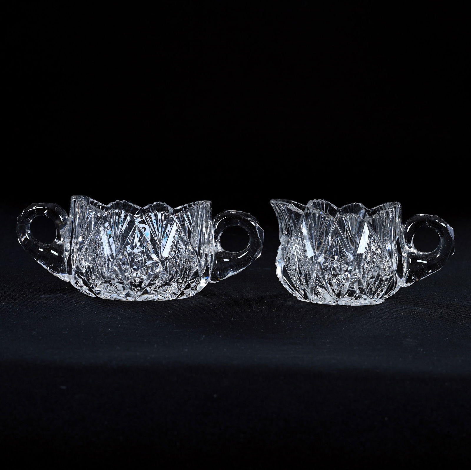 Oval Creamer And Sugar Set, American Brilliant Cut Glass, Hobstar, Strawberry Diamond And Fan Motif: Oval Creamer And Sugar Set, American Brilliant Cut Glass, Hobstar, Strawberry Diamond And Fan Motif, 2" x 5", Triple Notched Handle, Ray Cut Base, Sugar With Rim Nick, Eleanor Eulau Collection.