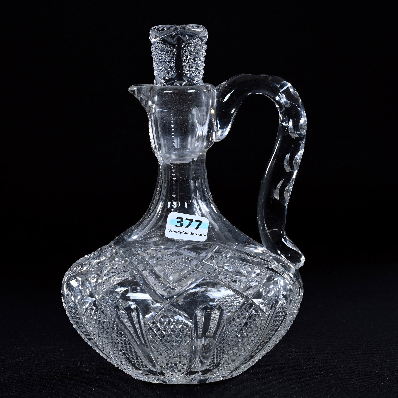 Decanter With Handle, American Brilliant Cut Glass, Alternating Panels Of Nailhead Diamond And: Decanter With Handle, American Brilliant Cut Glass, Alternating Panels Of Nailhead Diamond And Channels, 7.5" x 5.25", Hobstar And Prism Highlights, Pattern Cut Stopper, Ray Cut Base, Rim Nick, Eleano