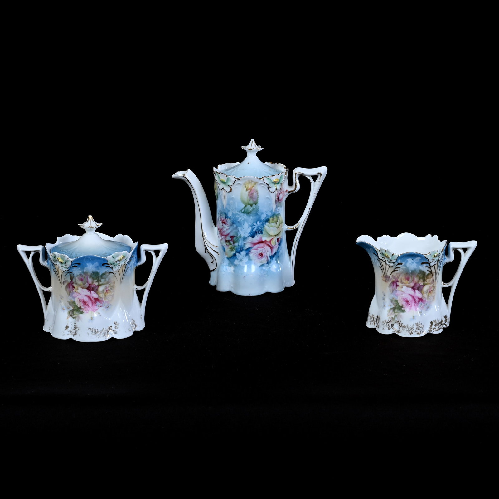 Tea Set, Unmarked R.S. Prussia, Lily Mold: Tea Set, Unmarked R.S. Prussia, Lily Mold, Pink And Yellow Rose Decor, Blue And White Tones, (1) 6.25" x 6.5" Tea Pot, (1) Creamer, (1) Sugar, Lou And The Late Norman Darland, TN.