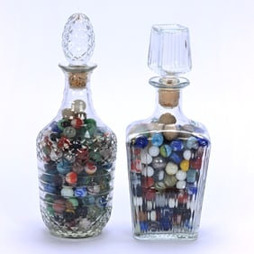 (2) Clear Pattern Glass Decanters, Filled With Wide Assortment Of Marbles