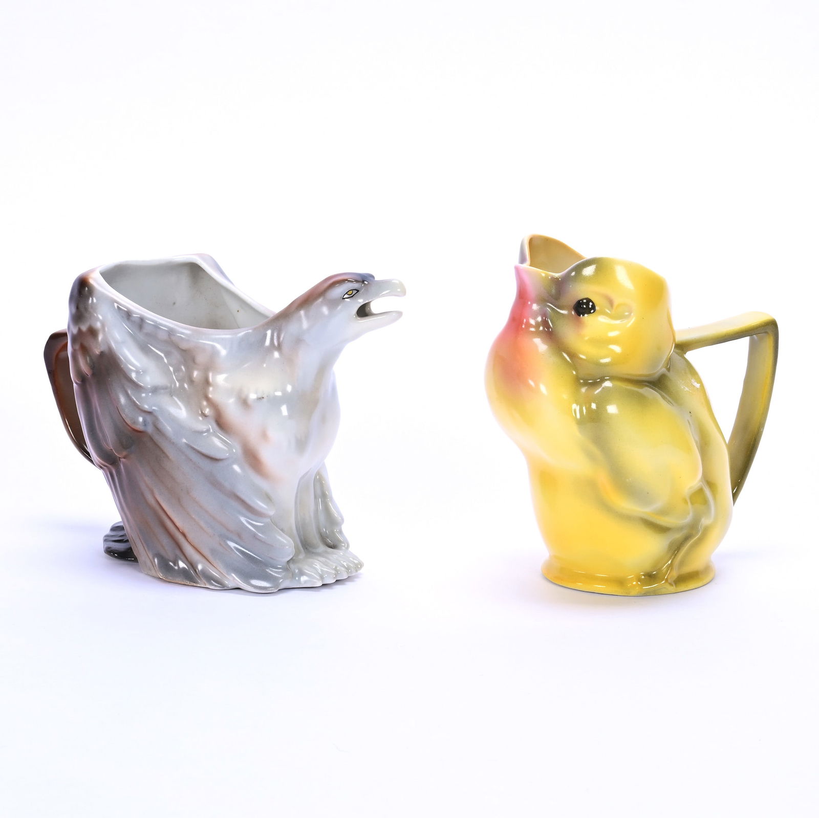 (2) Figural Royal Bayreuth Creamers: (2) Figural Royal Bayreuth Creamers, (1) 4" Yellow Chick, Unmarked, (1) 3.75" Eagle, Blue Mark, Illinois Private Collection.