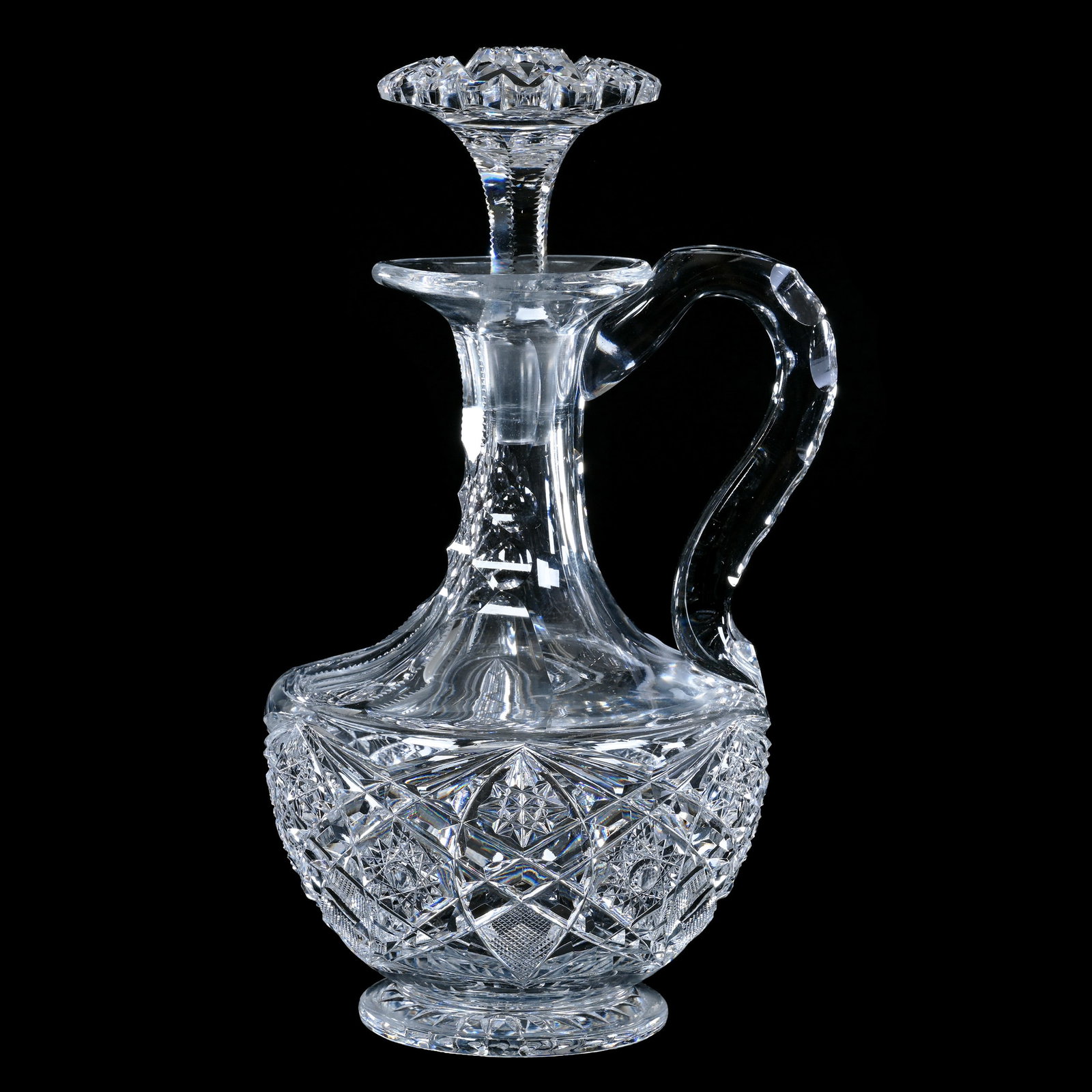 Decanter, Handled, American Brilliant Cut Glass, Hobstar, Vesica, Crosshatch & Miter Motif: Decanter, Handled, American Brilliant Cut Glass, Hobstar, Vesica, Crosshatch & Miter Motif, 10.25" x 5.75", Scalloped Hobstar Stopper, Ray Cut Foot, Sherri Schott Collection, Kansas.