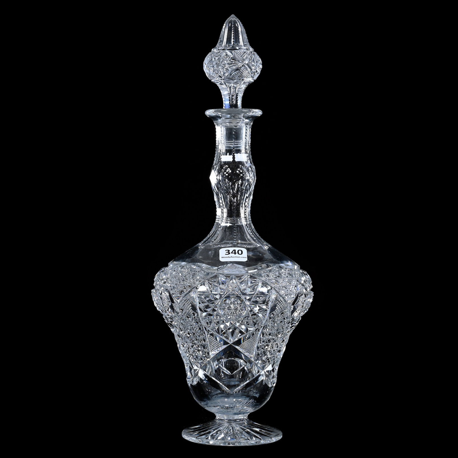 Pedestal Decanter, American Brilliant Cut Glass, Hobstar, Cane, Crosshatch, And Bullseye Motif: Pedestal Decanter, American Brilliant Cut Glass, Hobstar, Cane, Crosshatch, And Bullseye Motif, 13.75" x 5.5", Pattern Cut Acorn Shaped Stopper, Ray Cut Foot, Mike & Sandra Hackney, Georgia.
