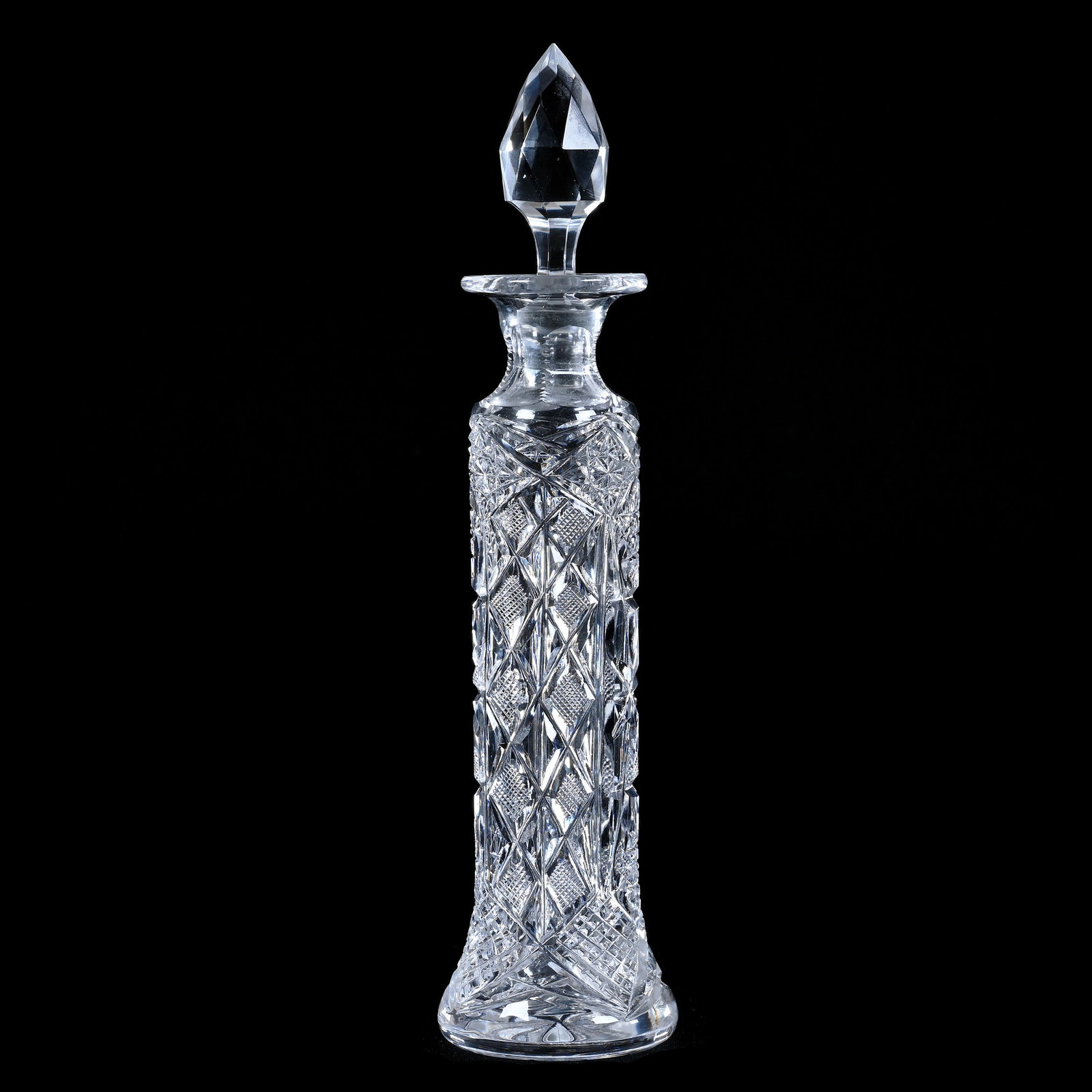 Perfume Bottle, American Brilliant Cut Glass, Hobstar, Crosshatch, Cross Cut Diamond, And Miter: Perfume Bottle, American Brilliant Cut Glass, Hobstar, Crosshatch, Cross Cut Diamond, And Miter Motif, 10" x 2.5", Facet Cut Gem Shaped Stopper, Ray Cut Base, Sherri Schott Collection, Kansas.