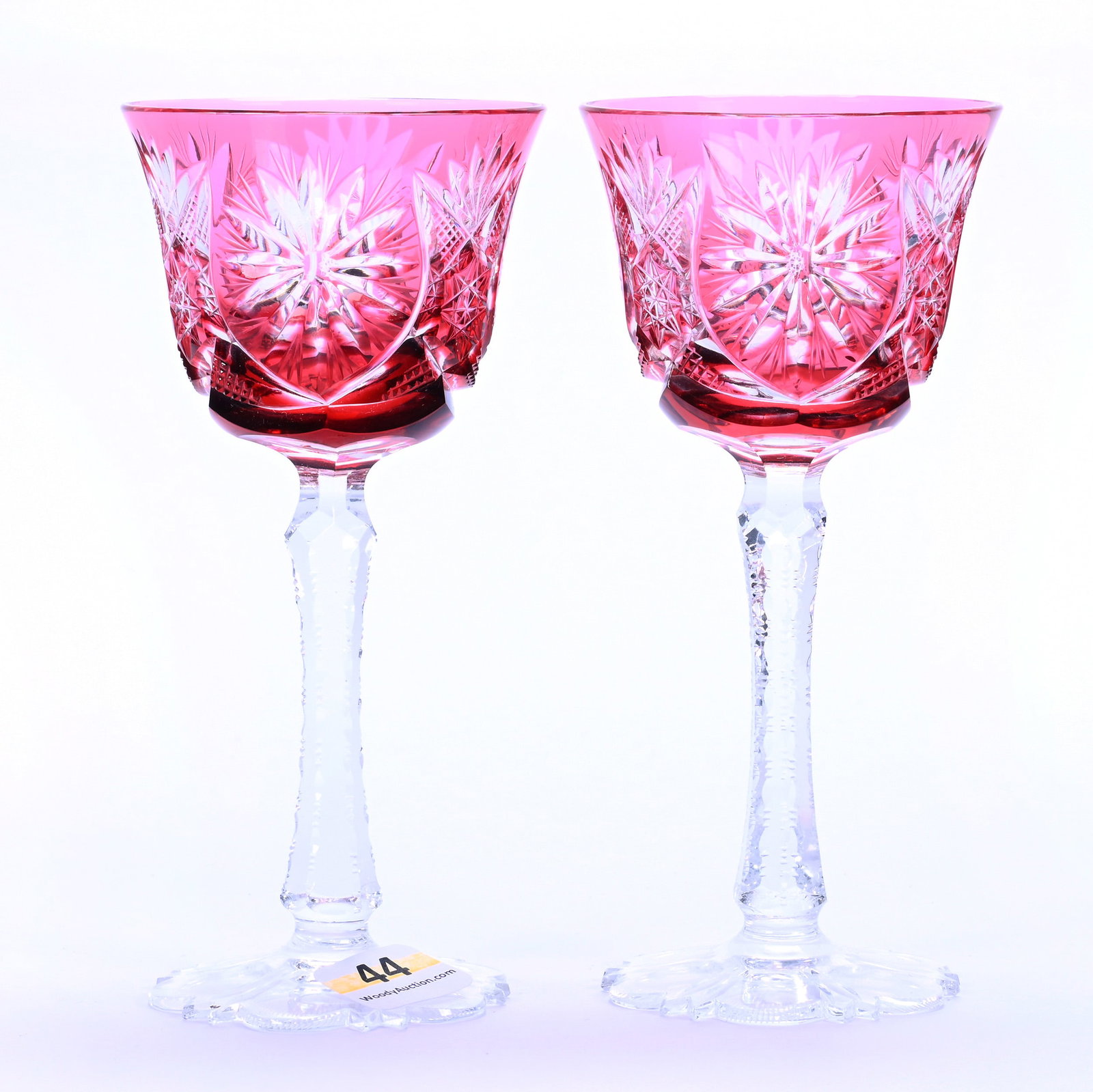 Pair Wine Stems, Brilliant Period Cut Glass, Cranberry Cut To Clear: Pair Wine Stems, Brilliant Period Cut Glass, Cranberry Cut To Clear, 5.75" x 2.625", Flashed Star, Hobstar, Crosshatch, And Fan Motif, Notched Stem, Scalloped Foot, Sherri Schott Collection, Kansas.