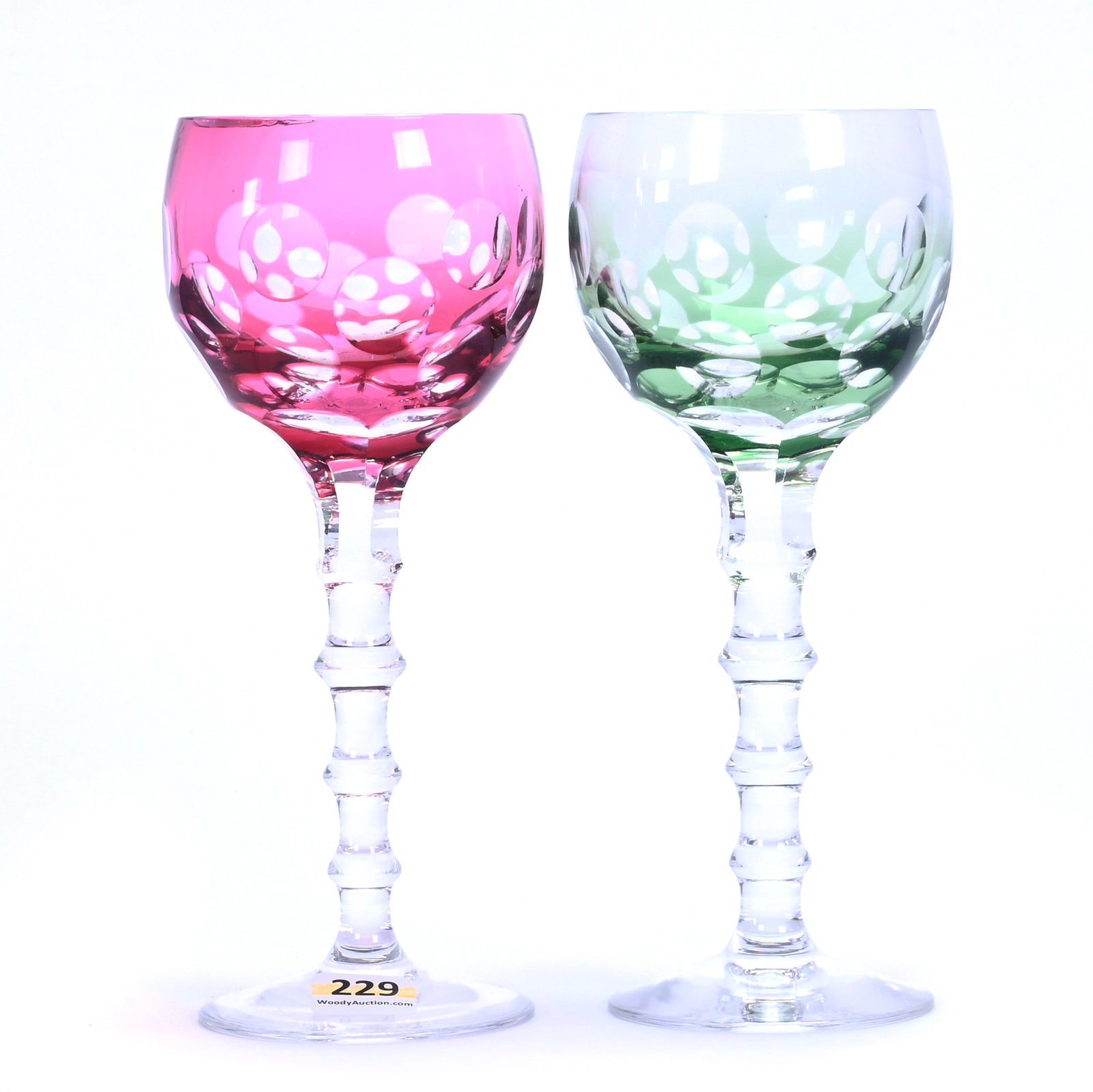 (2) Wine Stems, Cut Glass, Color Cut To Clear: (2) Wine Stems, Cut Glass, Color Cut To Clear, 7.75" x 3.25", Bullseye Window Motif, (1) Green, (1) Cranberry, Georgia Private Collection.
