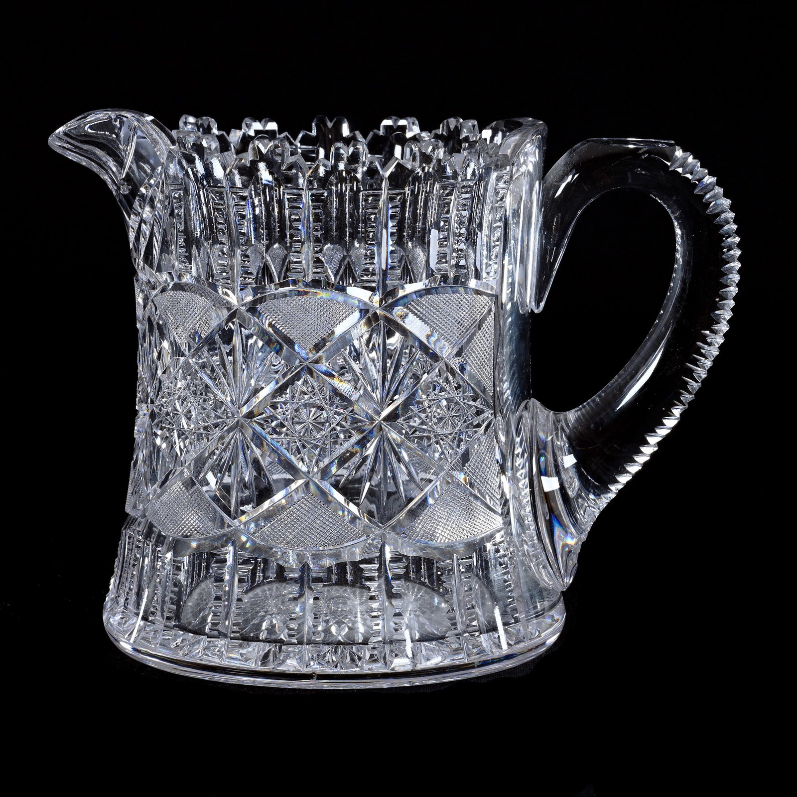 Cider Pitcher, American Brilliant Cut Glass, Well Cut Hobstar, Vesica, Fan, Punty And Prism Motif: Cider Pitcher, American Brilliant Cut Glass, Well Cut Hobstar, Vesica, Fan, Punty And Prism Motif, 6.75" x 8.5", Notched Handle, Hobstar Base, Georgia Private Collection.
