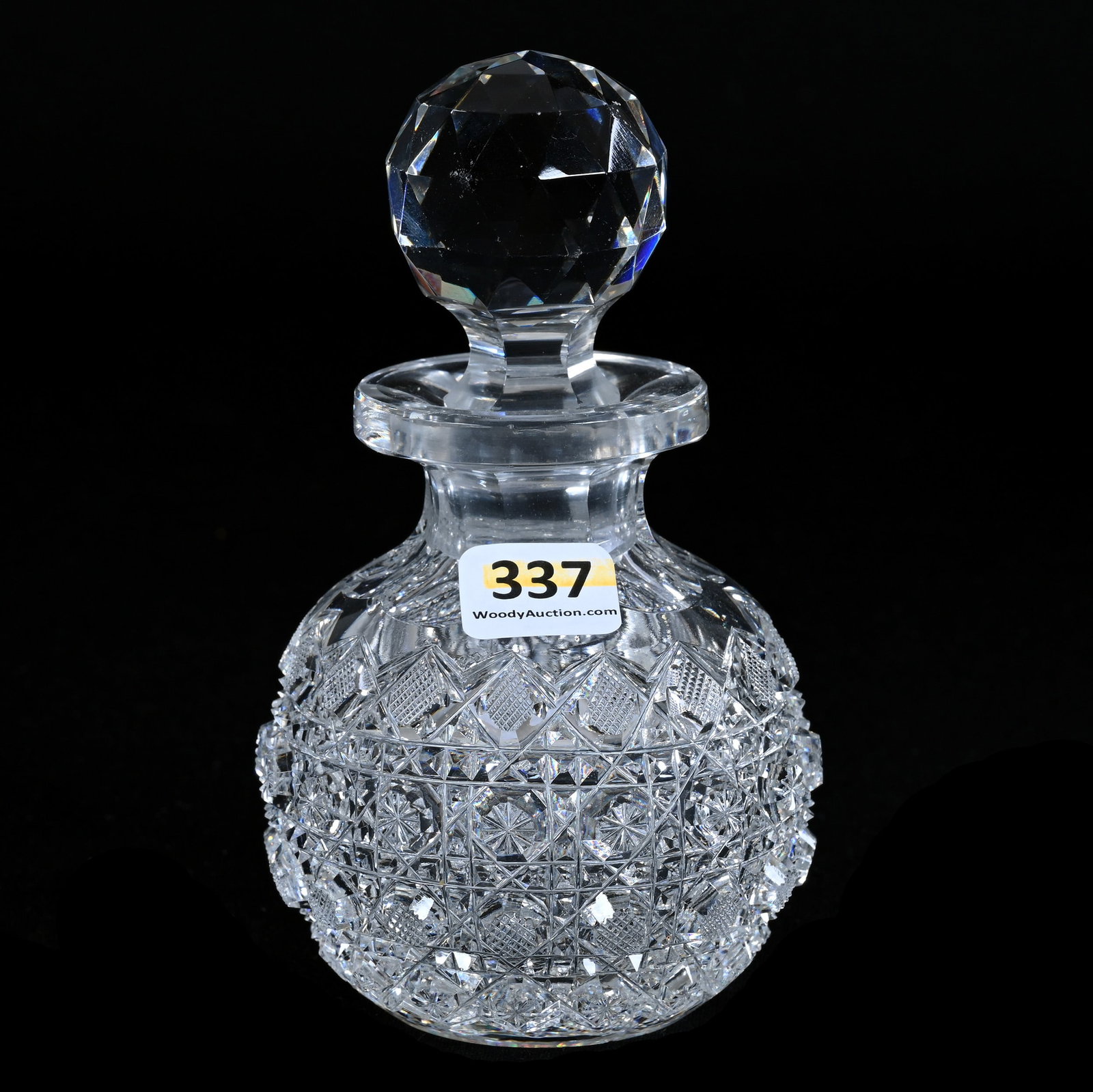 Cologne Bottle, American Brilliant Cut Glass, Well Cut Crosshatch, Miter, Star Button Motif: Cologne Bottle, American Brilliant Cut Glass, Well Cut Crosshatch, Miter, Star Button Motif, 5.75" x 3.25", Hobstar Cut Base, Stopper Plug Nick, Georgia Private Collection.