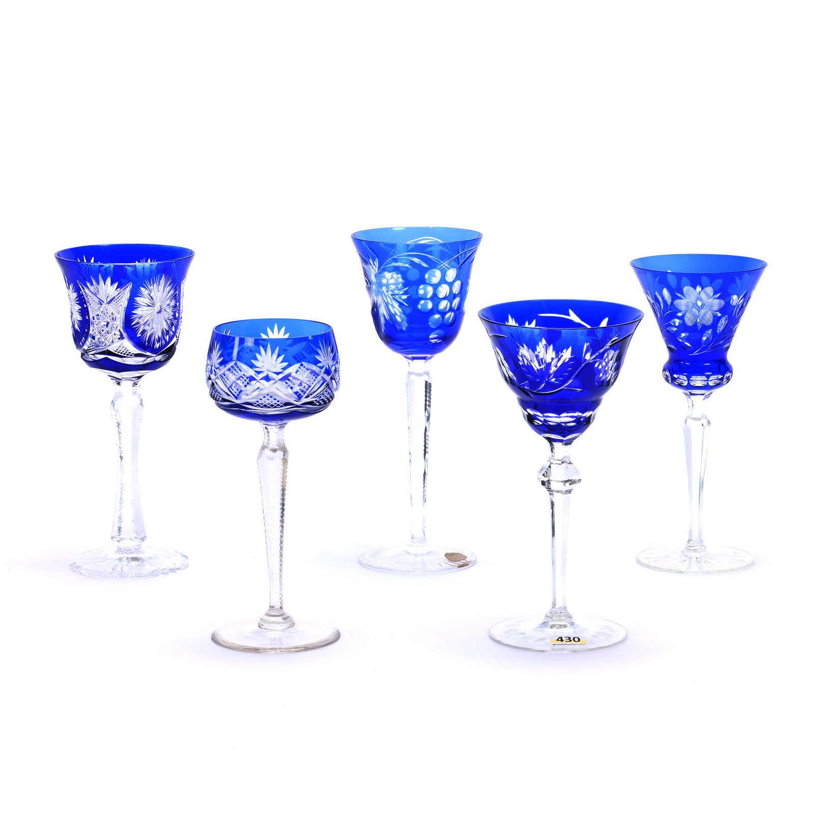 (5) Wine Stems, Cut Glass, Cobalt Blue Cut To Clear: (5) Wine Stems, Cut Glass, Cobalt Blue Cut To Clear, (3) With Engraved Floral, (2) Geometric Cut, Sizes From 7.5" To 8.5", Smallest And Tallest Wines Have Rim Nicks, Georgia Private Collection.