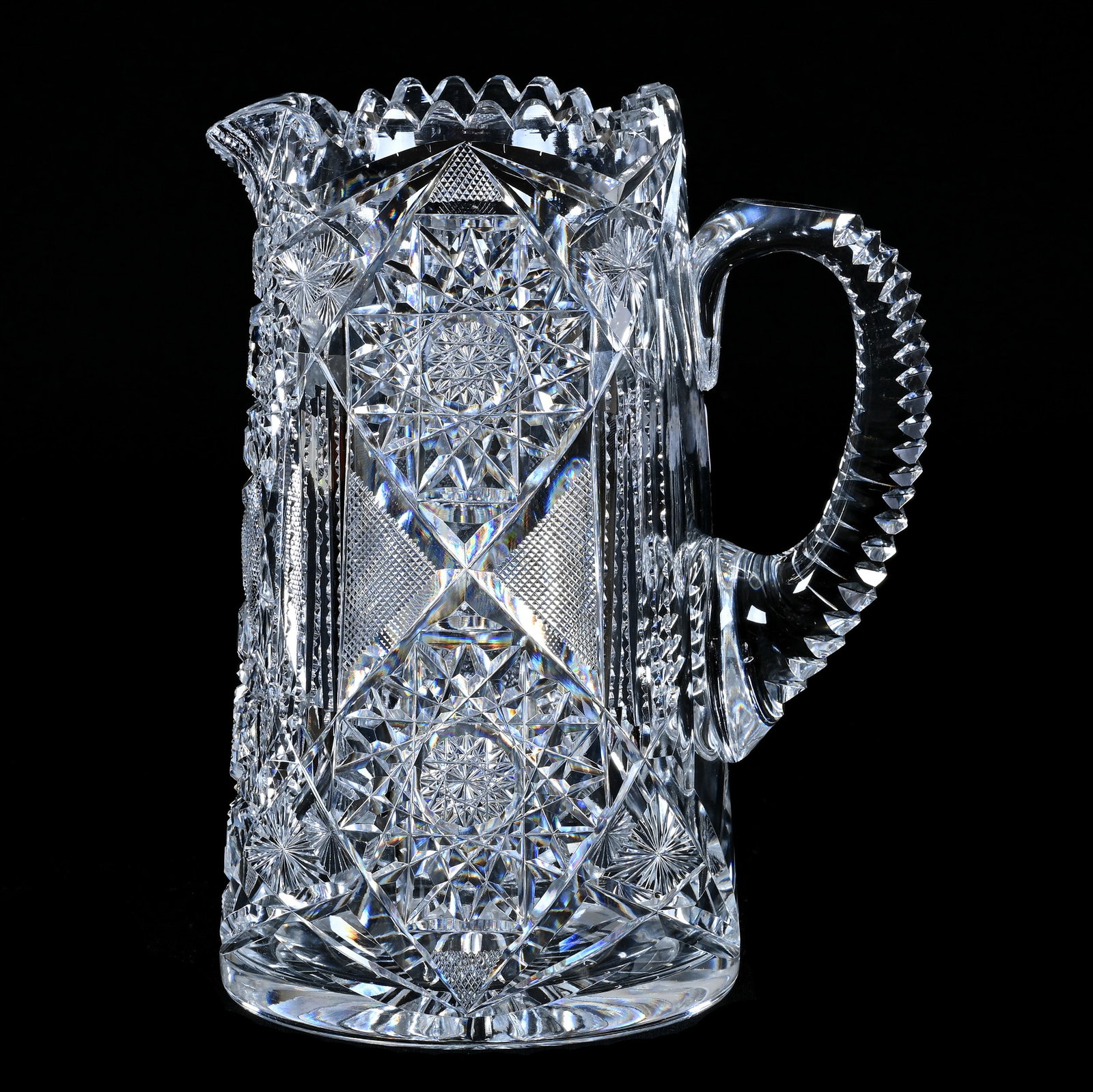 Pitcher, American Brilliant Cut Glass, Hobstar, Crosshatch, Prism And Star Motif: Pitcher, American Brilliant Cut Glass, Hobstar, Crosshatch, Prism And Star Motif, 8.75" x 6.75", Notched Handle, Ray Cut Base, Clear Blank, Georgia Private Collection.