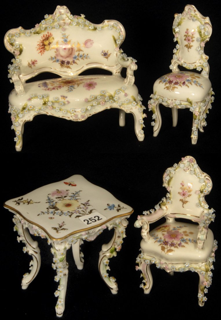 (4) PIECE MARKED DKF (DORNHEIM, KOCH & FISCHER) GERMAN: (4) PIECE MARKED DKF (DORNHEIM, KOCH & FISCHER) GERMAN PORCELAIN MINIATURE SET WHITE W/ APPLIED FLORAL TRIM AND HAND PAINTED FLORAL DECOR - SET FEATURES SQUARE TABLE, ARM CHAIR, SIDE CHAIR AND COUCH -