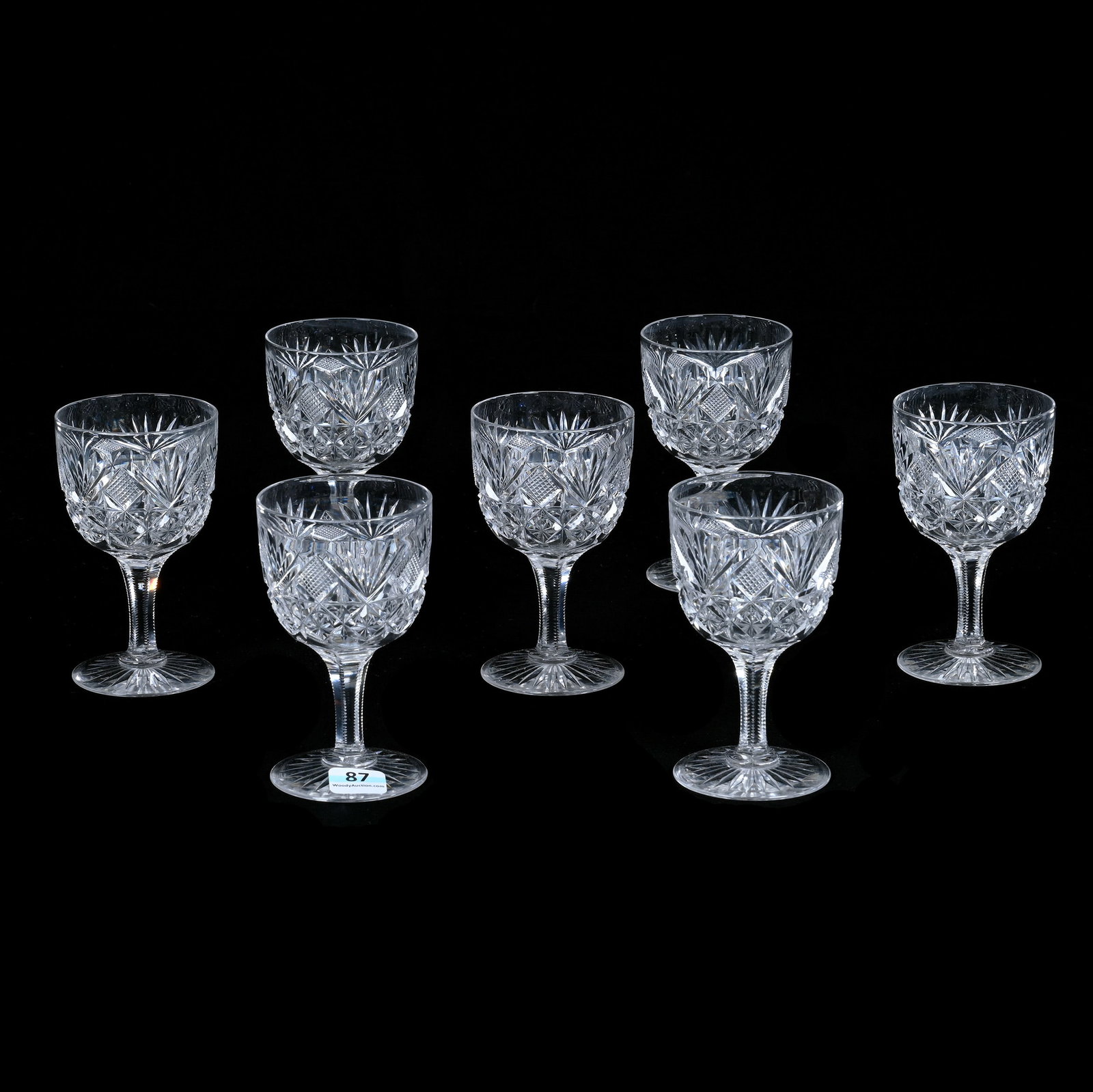 (7) Wine Stems, American Brilliant Cut Glass: (7) Wine Stems, American Brilliant Cut Glass, 4.5" x 2.75" x 2.75", 2.4 Pounds, Crosscutting, Quartered Diamond, Star, And Fan Motif, Ray Cut Foot, The Bob Lawroski Estate.