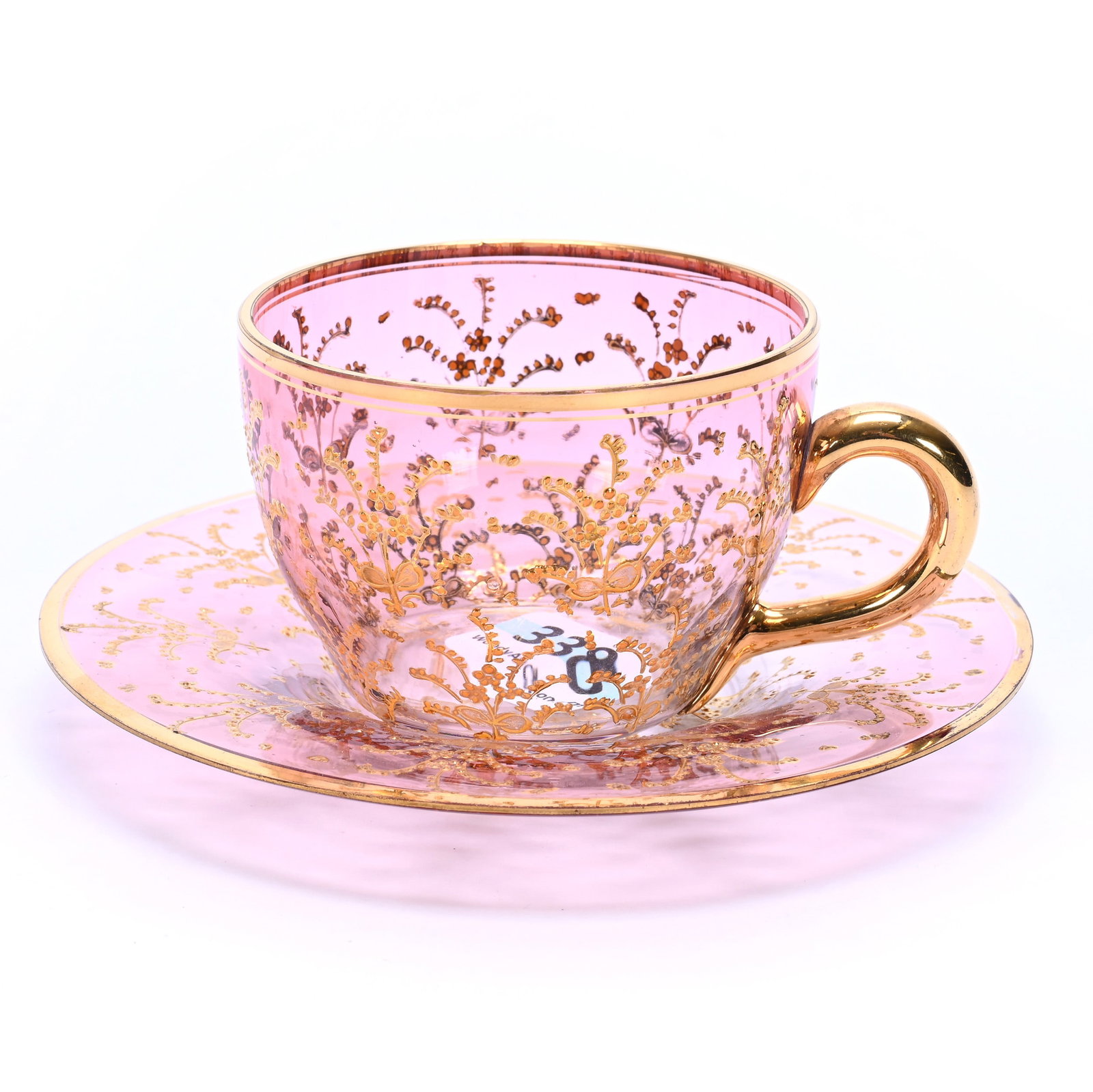 Cup And Saucer, Rubina Art Glass, Extensive Gold Enamel Decor: Cup And Saucer, Rubina Art Glass, Extensive Gold Enamel Decor, 2" x 4.5" x 4.5", 0.26 Pounds, Moser Style, Bill And Kathleen Pratt Collection, Kansas.