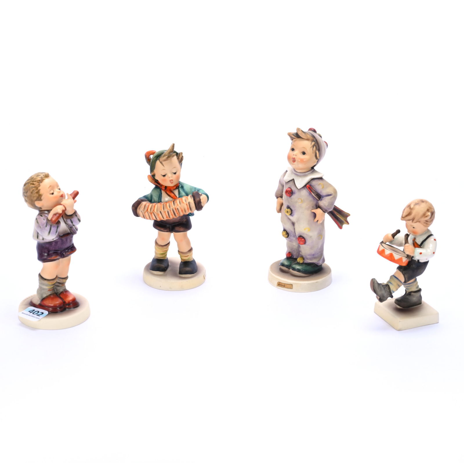 (4) Hummel Figurines: (4) Hummel Figurines, 0.96 Pounds, (1) 5.75" x 2.5" x 2.5", Carnival #328, TM-4, (1) 5.25" x 2.75" x 2.25", Accordion Boy #185, TM-5, (1) 5" x 2.25" x 2.25", Morning Concert #447, TM-5, Exclusive Spec