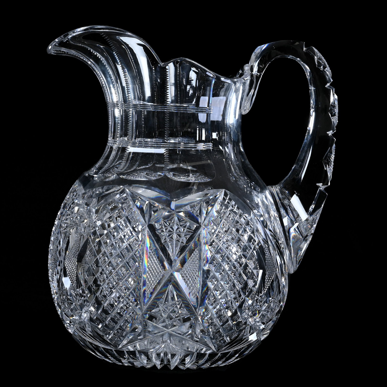 Pitcher, American Brilliant Cut Glass: Pitcher, American Brilliant Cut Glass, 9.5 x 8.25 x 6.5 Inches, Alternating Sections Of Crosscut Diamond, Hobstar, And Crosscutting Motif, Pattern Cut Handle, Ray Cut Base, Base With Some Pattern Chip
