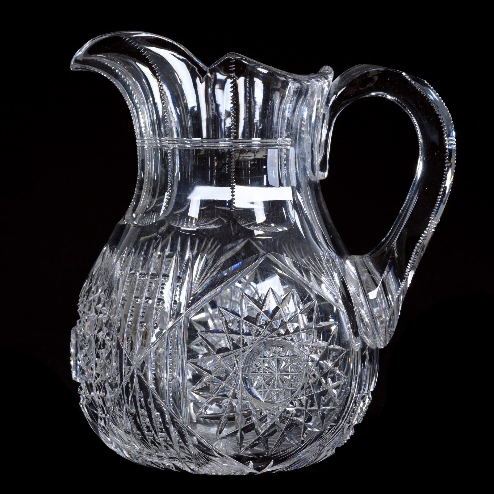 Pitcher, American Brilliant Cut Glass, Hobstar, Prism, And Fan Motif: Pitcher, American Brilliant Cut Glass, Hobstar, Prism, And Fan Motif, 7.75 x 6.75 x 5.5 Inches, Ray Cut Base, Clear Blank, 4 Pounds, The Mary Petrie Collection, Kansas.