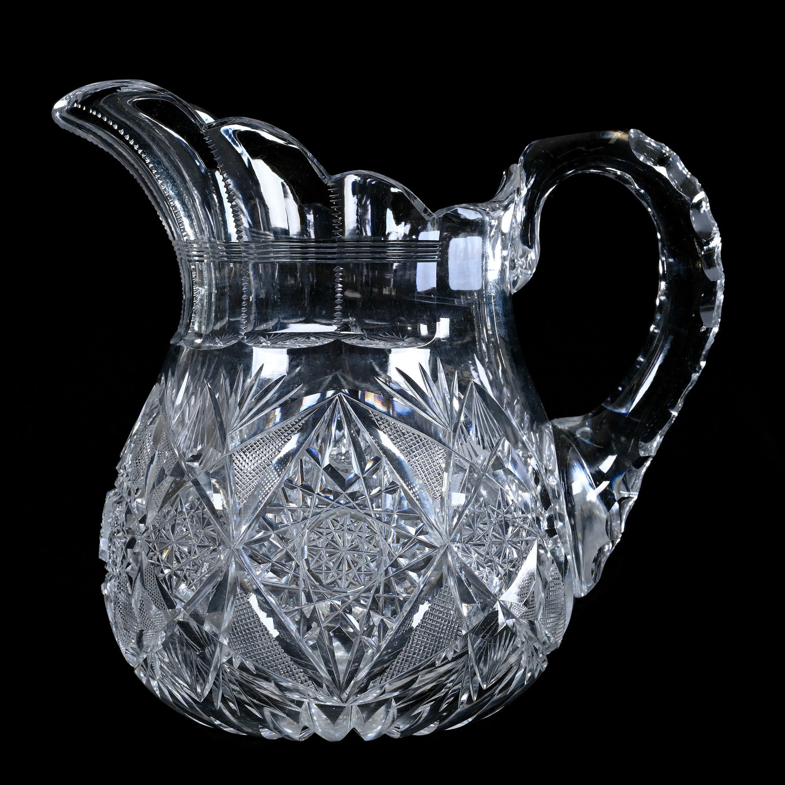 Pitcher, American Brilliant Cut Glass, Hobstar, Vesica, Crosscutting, And Fan Motif: Pitcher, American Brilliant Cut Glass, Hobstar, Vesica, Crosscutting, And Fan Motif, 7.25 x 7.75 x 5.5 Inches, Double Notched Handle, Ray Cut Base, Some Pattern Chips, 4 Pounds, The Mary Petrie Collec