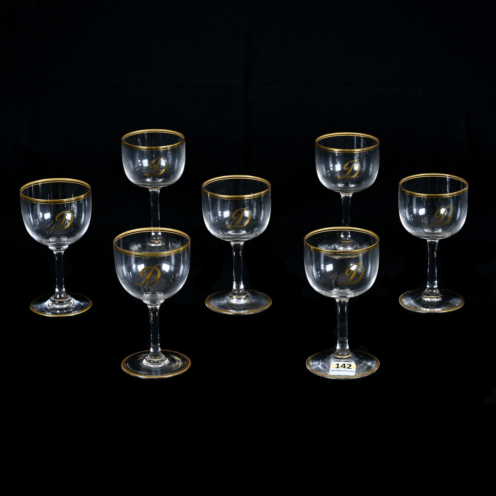 (7) Wine Stems, Unmarked Dorflinger Honesdale Style: (7) Wine Stems, Unmarked Dorflinger Honesdale Style, 4.5 x 2.5 x 2.5 Inches, Clear Crystal With Gold Stencil Trim And Gold Monogram D, Monogram Matched Previous Lot (141), 2 Pounds, Private Collection