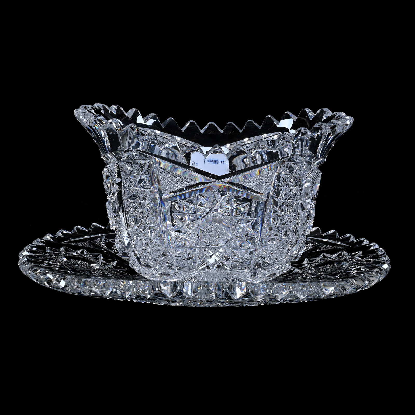 Oval Gravy Boat With Underplate, American Brilliant Cut Glass: Oval Gravy Boat With Underplate, American Brilliant Cut Glass, 4 x 8 x 5.125 Inches, Four Alternating Sections Of Hobstar, Cane, And Crosscutting Motif, One Tooth With Hard To See Edge Chip, 3 Pounds,
