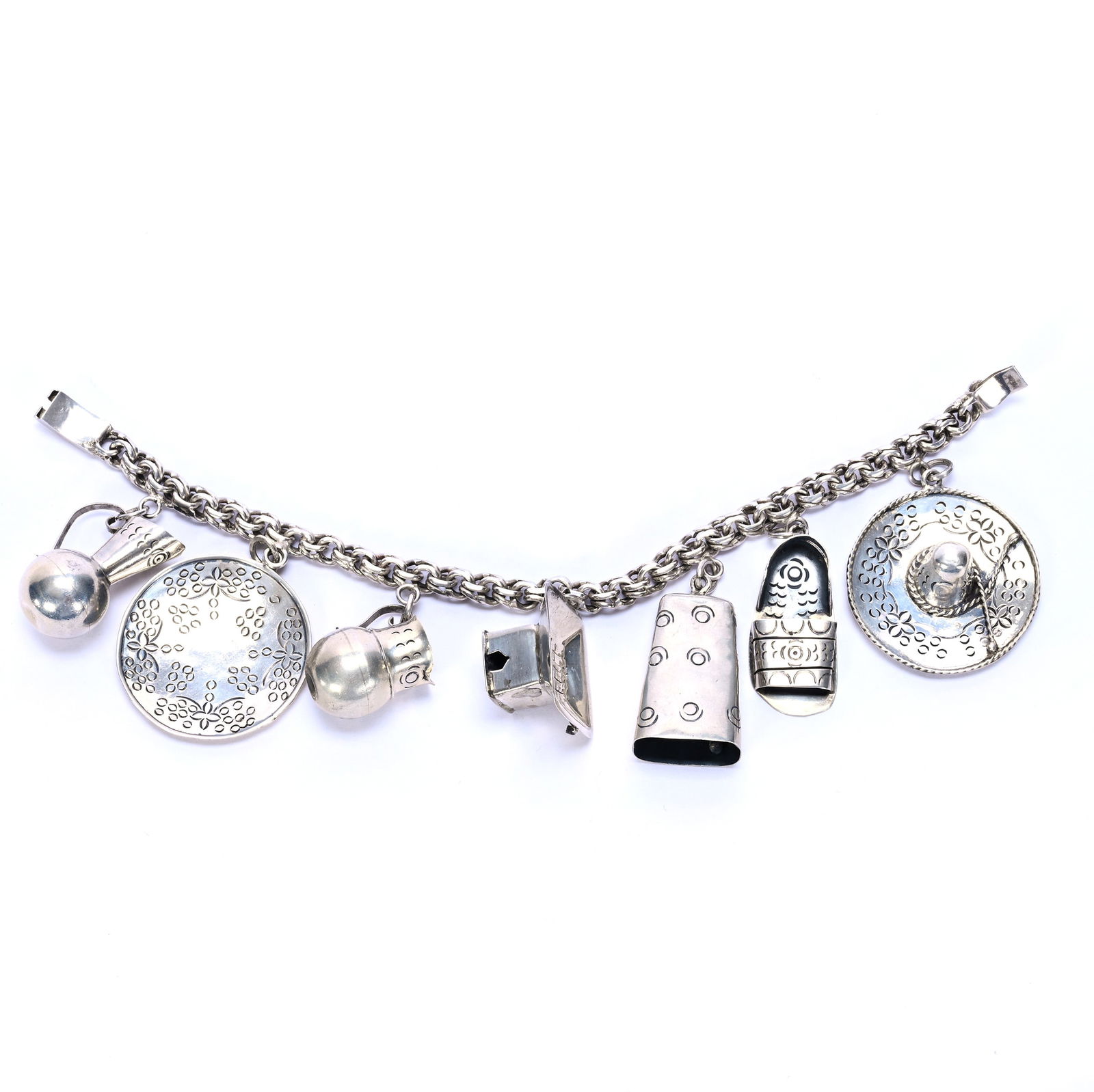 Solid Sterling Silver Charm Bracelet, Unmarked, Mexican Silver Attributed To Castelan: Solid Sterling Silver Charm Bracelet, Unmarked, Mexican Silver Attributed To Castelan, 8 x 2 x 1 Inches, Charms Include Two Jugs, A Plate, Sandal, Bell And Sombrero, 49.0 Grams, Dr. Harold & Audrey