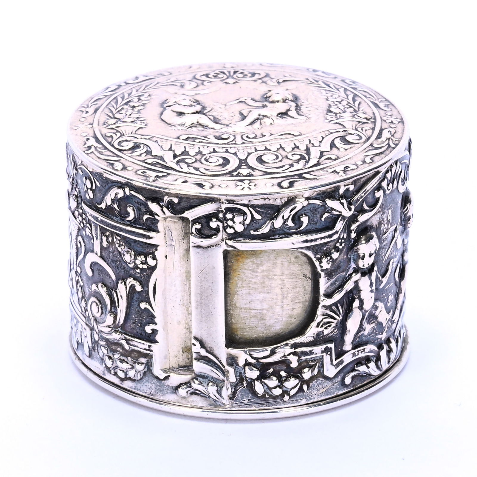Solid German Silver Tape Measure Case, 800 Purity: Solid German Silver Tape Measure Case, 800 Purity, 1.5 x 2 x 2 Inches, Elaborate Embossed Cherub Design, No Tape Measure Included, 59.0 Grams, Dr. Harold & Audrey Eklund Estate, Iowa.