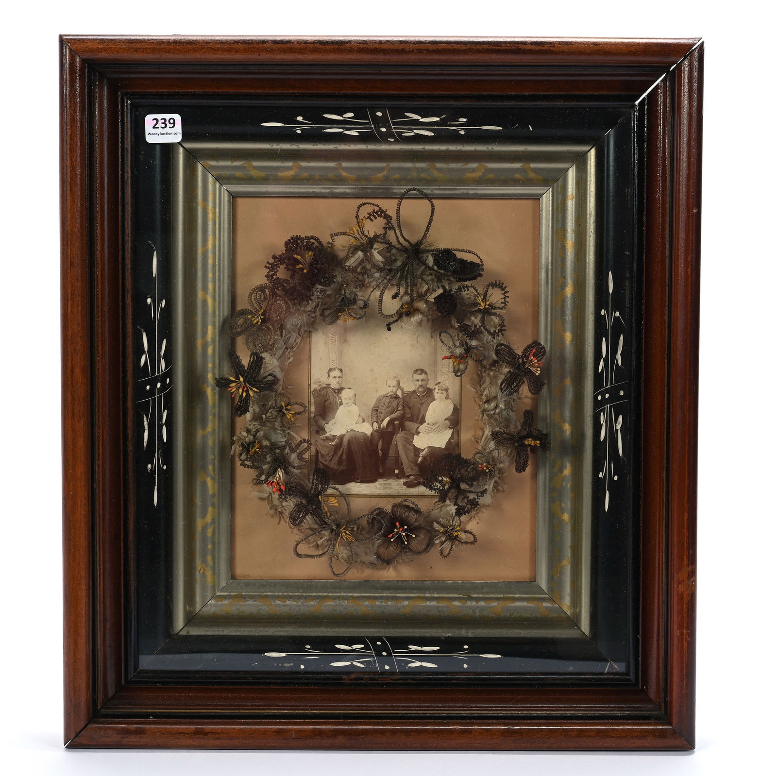 Framed Hair Wreath With Vintage Family Photo: Framed Hair Wreath With Vintage Family Photo, 17 x 15.25 x 4 Inches, Mounted In Walnut & Ebony Frame, 5.5 Pounds, Dr. Harold & Audrey Eklund Estate, Iowa.