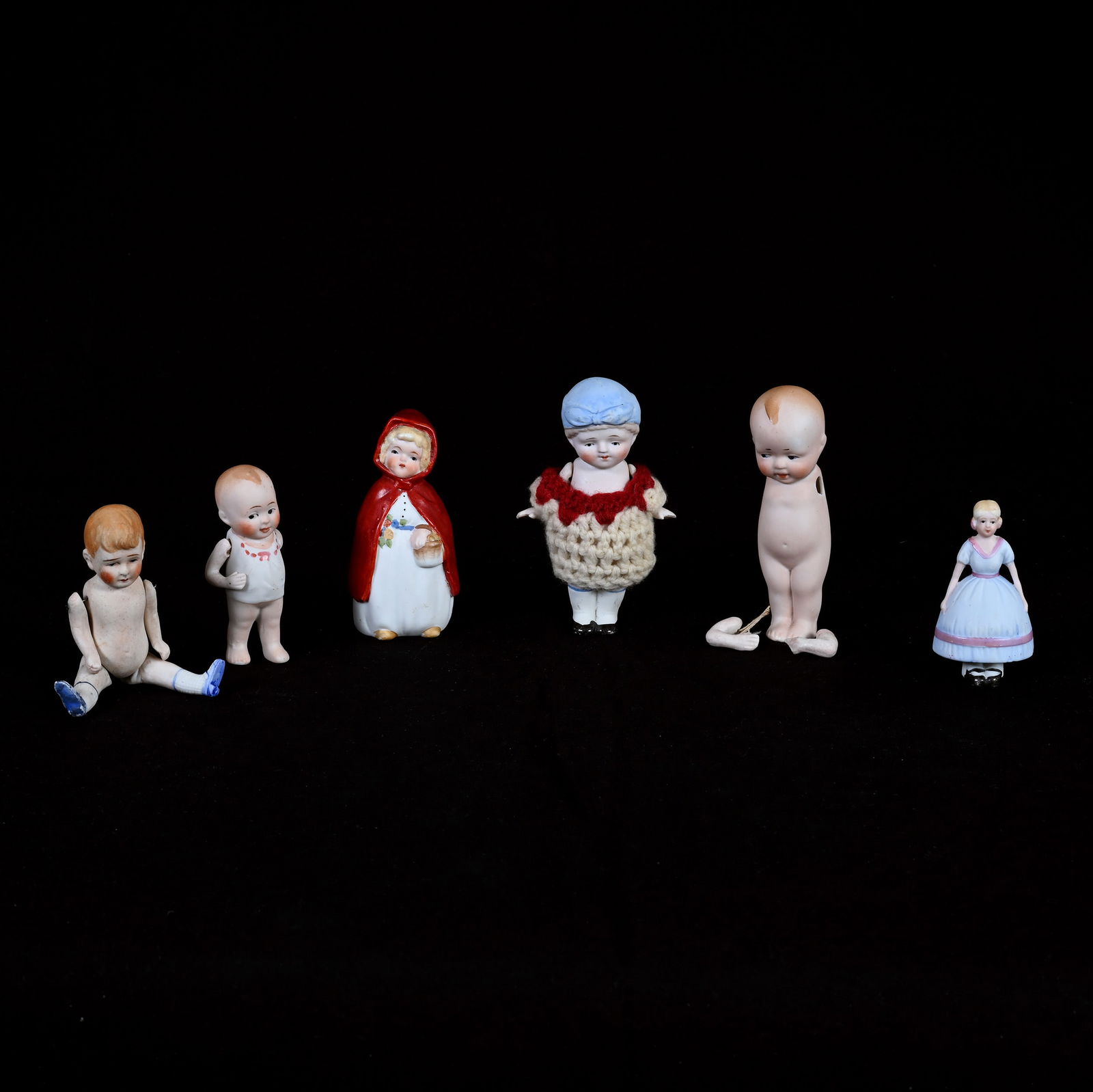 (6) Japanese Bisque Dolls Marked Nippon: (6) Japanese Bisque Dolls Marked Nippon, 4.5 x 2.5 x 1.5 Inches, Various Sizes And Designs, One Doll Needs Arms Re-Strung, See Photos For Details, 0.7 Pounds, Dr. Harold & Audrey Eklund Estate, Iowa.