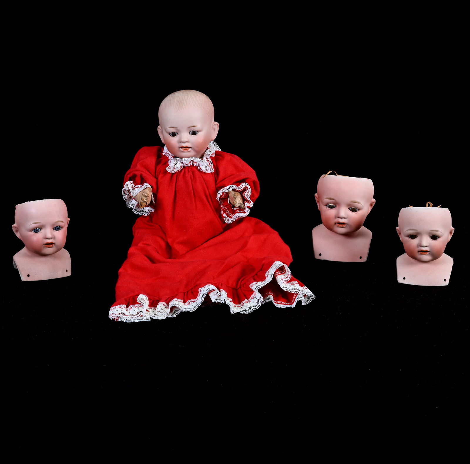 (4) Japanese Bisque Head Dolls Marked Nippon: (4) Japanese Bisque Head Dolls Marked Nippon, (1) 12" x 6" x 3" Doll With Composition Body & Red Dress, (2) 4" Doll Heads In Original Boxes, (1) 4.5" Doll Head, 2.1 Pounds, Dr. Harold & Audrey Eklund