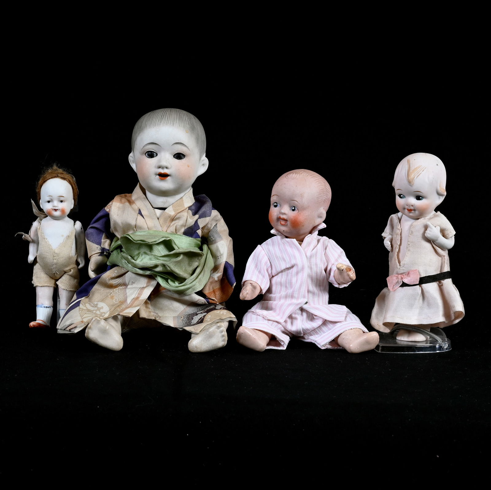 (4) Japanese Bisque Dolls Marked Nippon: (4) Japanese Bisque Dolls Marked Nippon, 9 x 4 x 2.5 Inches, Smallest Is 4.5", See Photos For Details, 1.3 Pounds, Dr. Harold & Audrey Eklund Estate, Iowa.