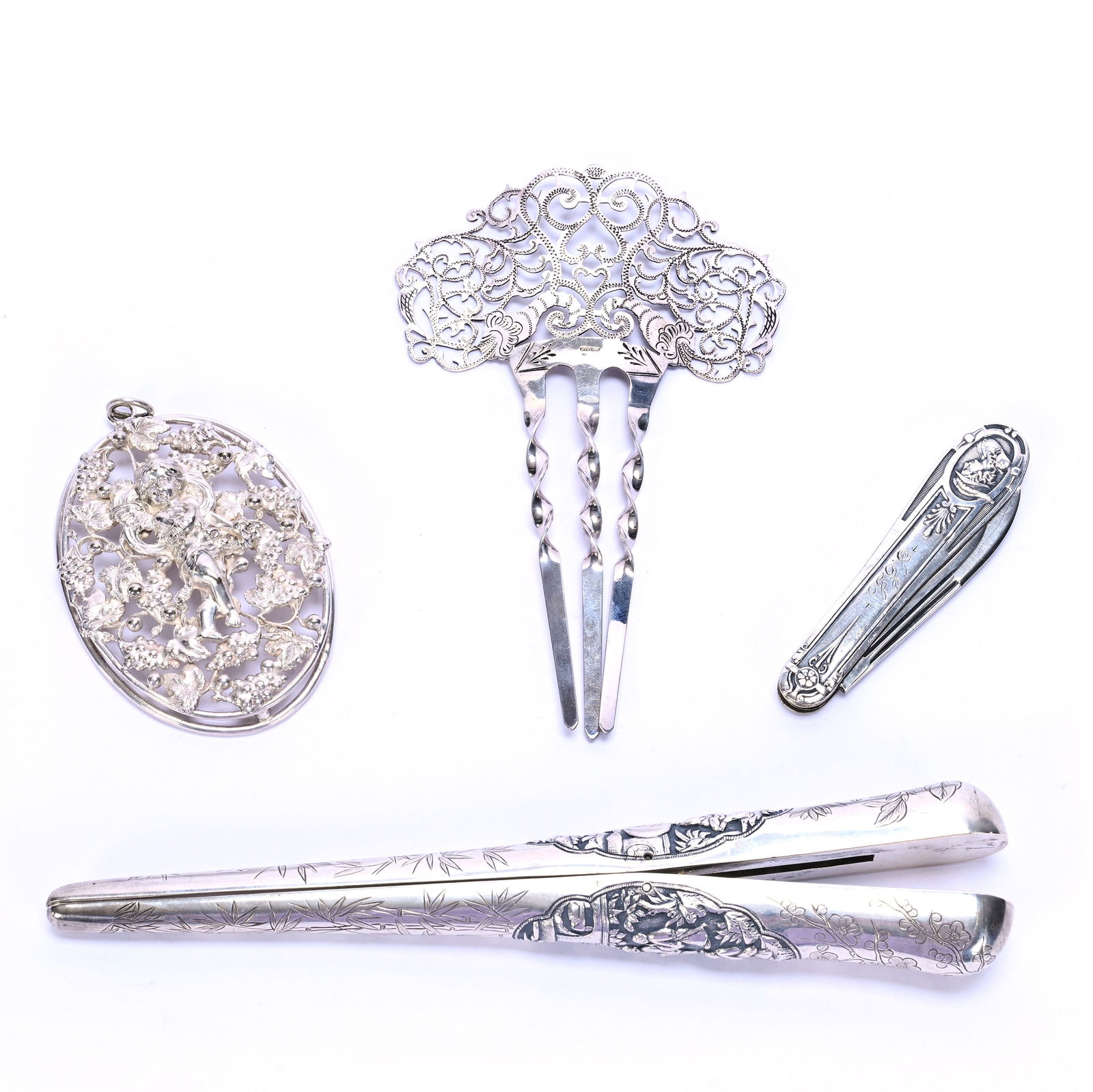 (4) Solid Silver Vanity Items: (4) Solid Silver Vanity Items, 7.5 x 3.25 x 0.75 Inches, (1) Curling Iron, Chinese Design, No Visible Maker's Marks, (1) Ornate Hair Comb Marked Sterling, (1) Pocket Knife With Sterling Blades Marked