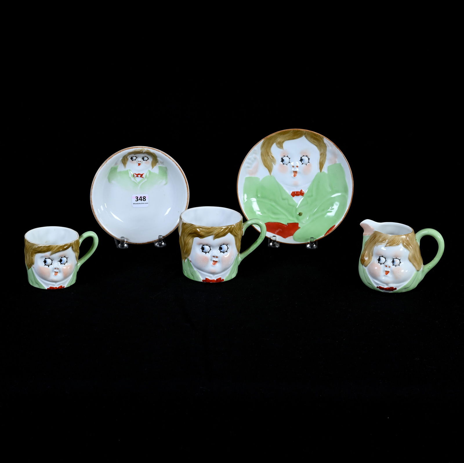 Child's Googly Eye Set Marked Nippon, Five Pieces: Child's Googly Eye Set Marked Nippon, Five Pieces Including (1) 6" Plate, (1) 5.25" Bowl, (1) 3" Mug, (1) 2.5" Mug, (1) 3.25" Creamer, 1.7 Pounds, Dr. Harold & Audrey Eklund Estate, Iowa.