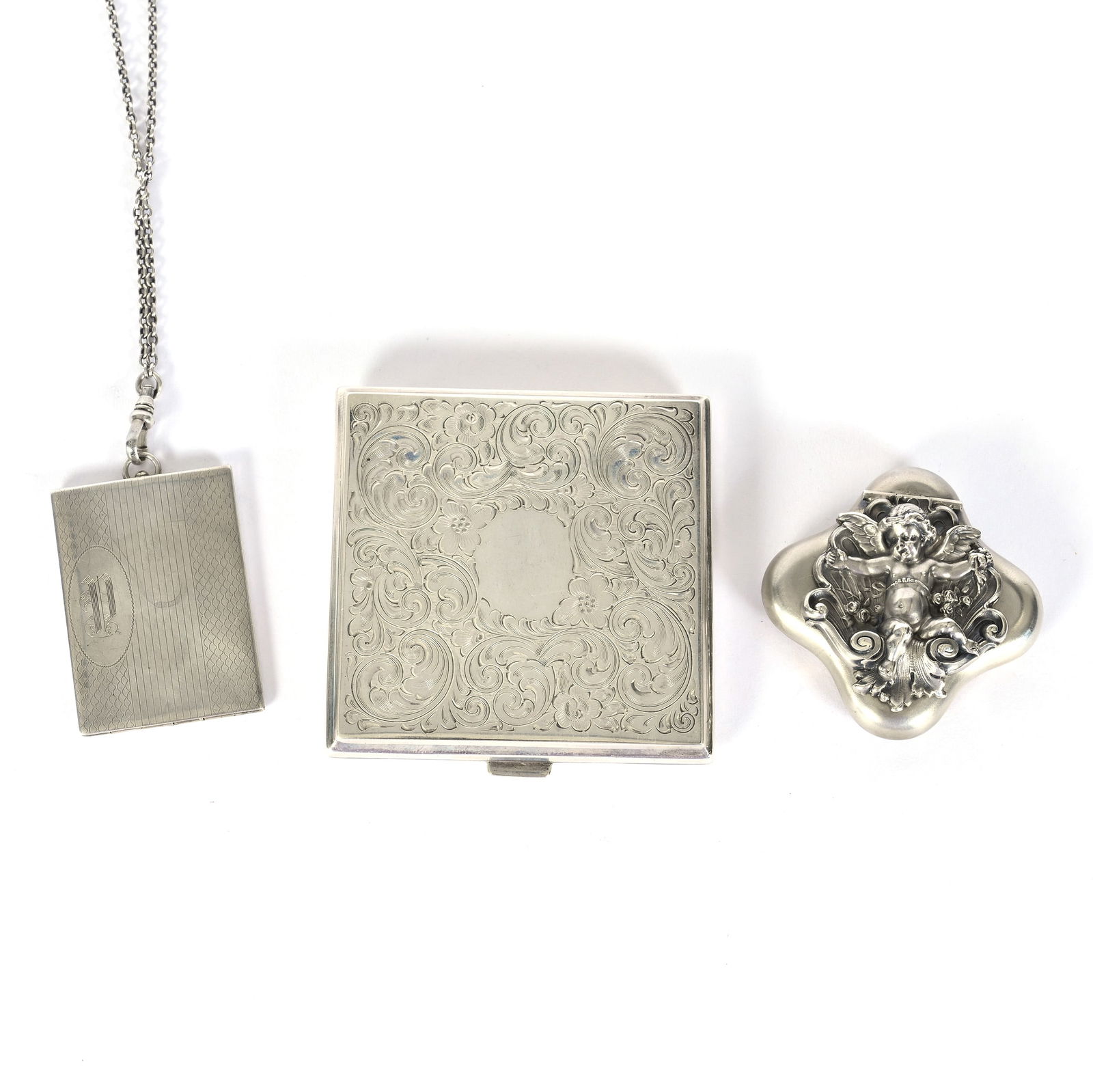 (3) Sterling Silver Items: (3) Sterling Silver Items, 2.5 x 2.5 x 0.5 Inches, (1) Pill Box With Winged Cherub Marked Kerr & Company, (1) Compact Marked "RB Company "R. Blackinton 1528", (1) Long Chain With Locket Marked