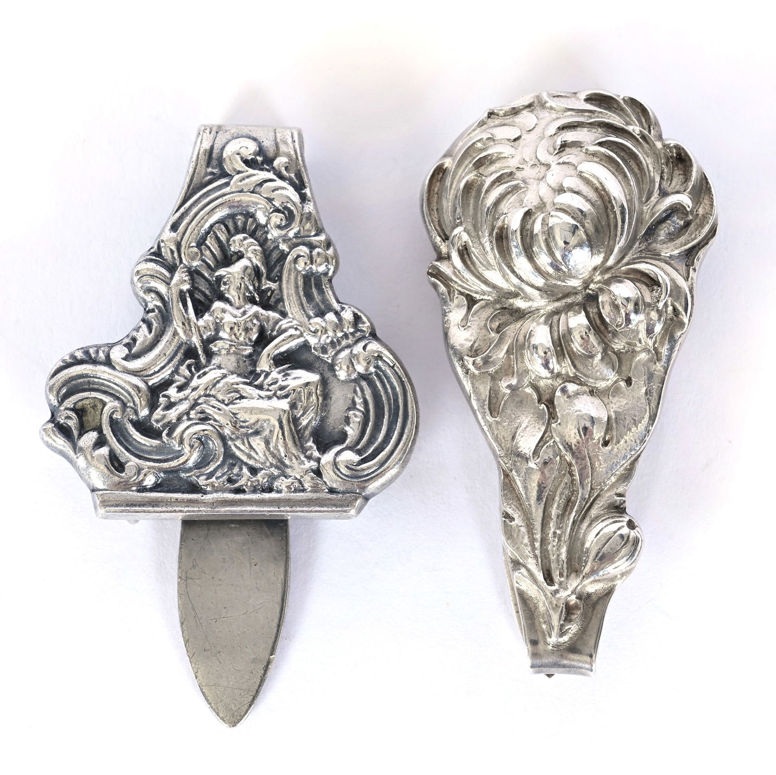 (2) Solid Sterling Silver Chatelaine Belt Hooks: (2) Solid Sterling Silver Chatelaine Belt Hooks, 2.5 x 1.5 x 1.5 Inches, (1) Marked "139", Seated Warrior Embossed Design, (1) Marked "B787M" With Chrysanthemum Design, 58.0 Grams, Dr. Harold &