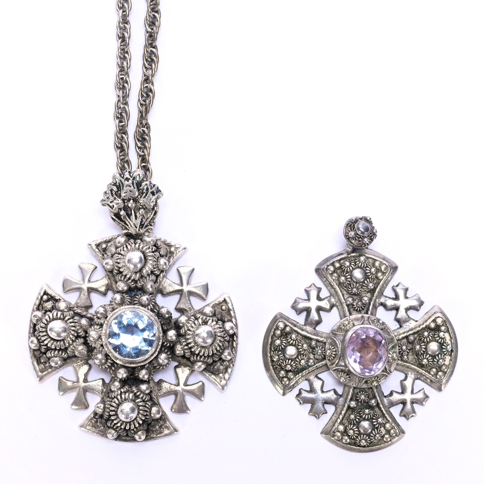(2) Solid Silver Jerusalem Crosses With Gem Centers, 900 Purity: (2) Solid Silver Jerusalem Crosses With Gem Centers, 900 Purity, 1.75 x 1.5 x 0.5 Inches, (1) Amethyst Gem, (1) Blue Gem, 55.0 Grams, Dr. Harold & Audrey Eklund Estate, Iowa.