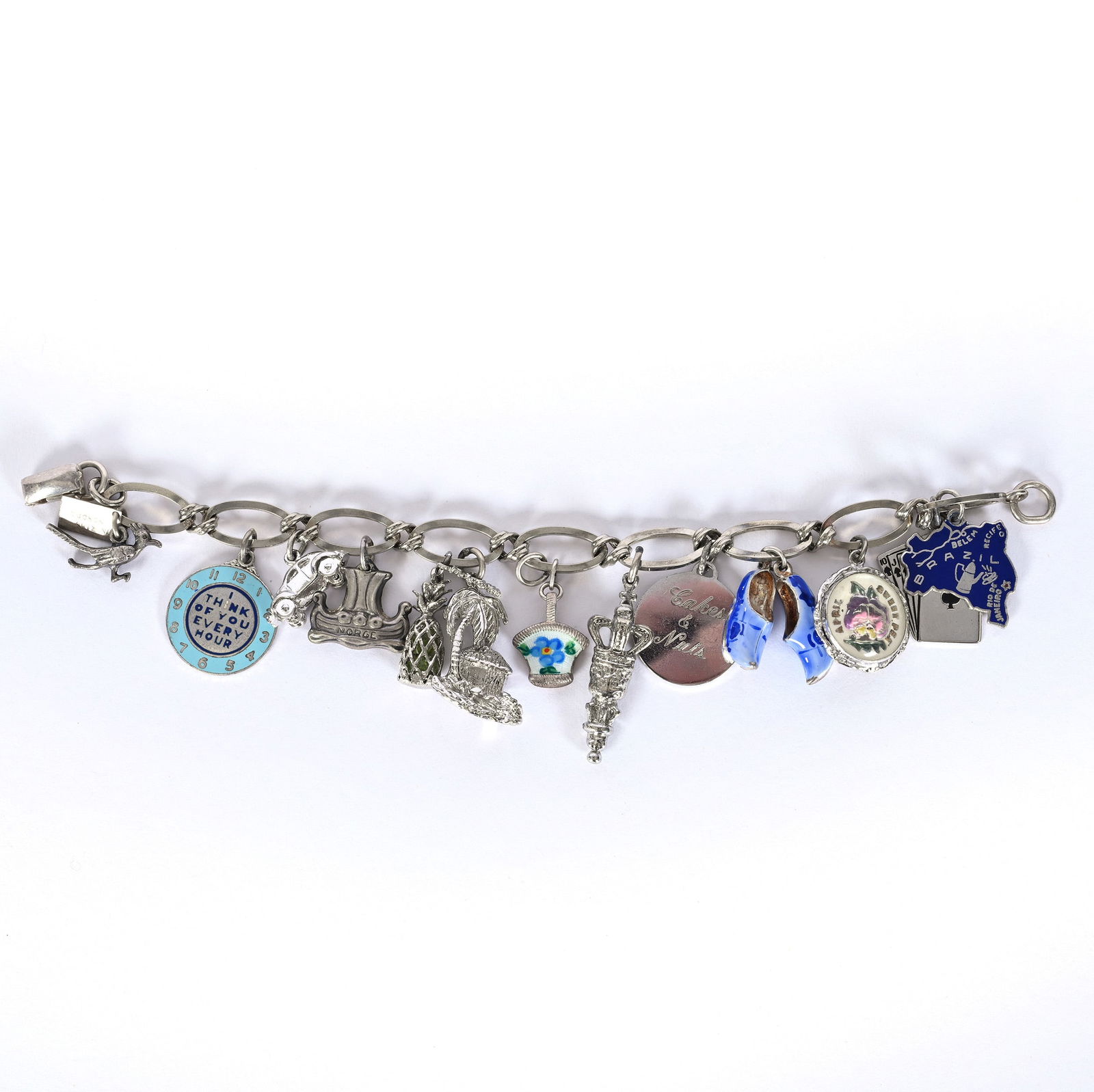 Solid Sterling Silver Charm Bracelet Marked Bell (New Mexico Trading Post) With (14) Charms: Solid Sterling Silver Charm Bracelet Marked Bell (New Mexico Trading Post) With (14) Charms, 7 x 1.5 x 0.25 Inches, Bell Began Business In 1932, 42.0 Grams, Dr. Harold & Audrey Eklund Estate, Iowa.