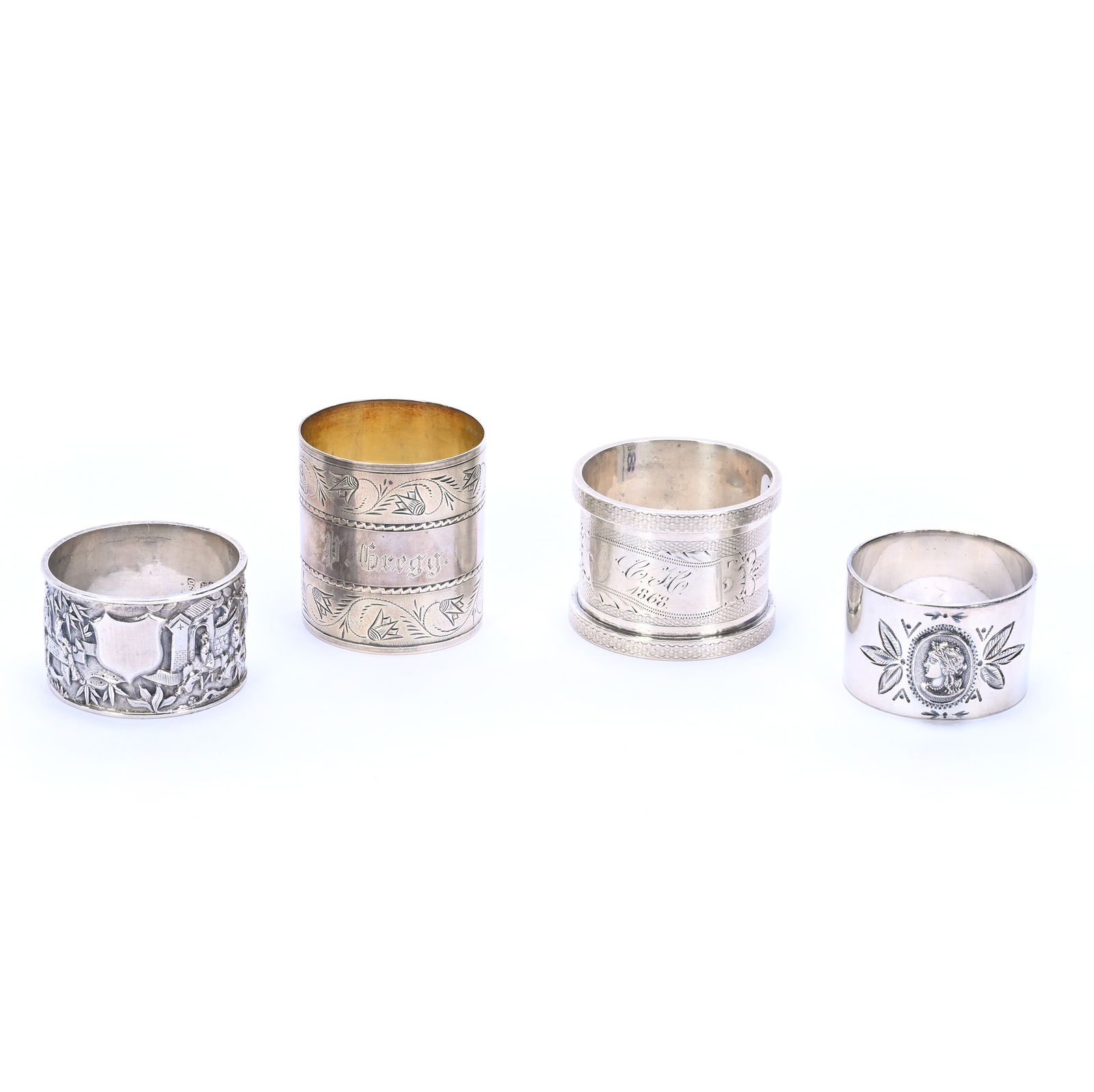 (4) Solid Silver Napkin Rings: (4) Solid Silver Napkin Rings, 1.75 x 2 x 2 Inches, (1) Embossed Chinese Design Marked 90 Purity, (1) Medallion Head And More, 154.0 Grams, Dr. Harold & Audrey Eklund Estate, Iowa.