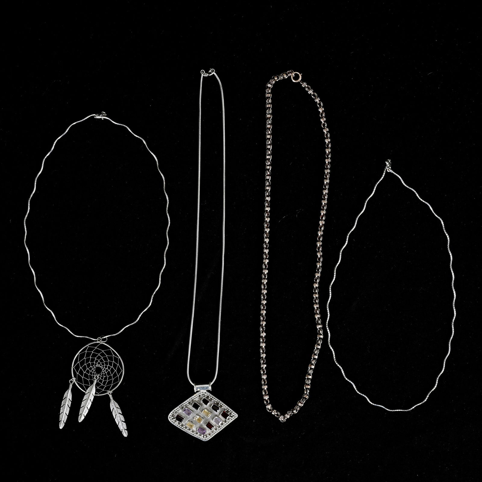 (3) Necklaces Including: (3) Necklaces Including (1) 18" Sterling Silver With Diamond Shape Pendant With Colored Gem Stones, (1) 22.5" 10k Gold Chain, (1) 18" Silver With Dream Catcher Pendant, Includes Two Chains, One Loose
