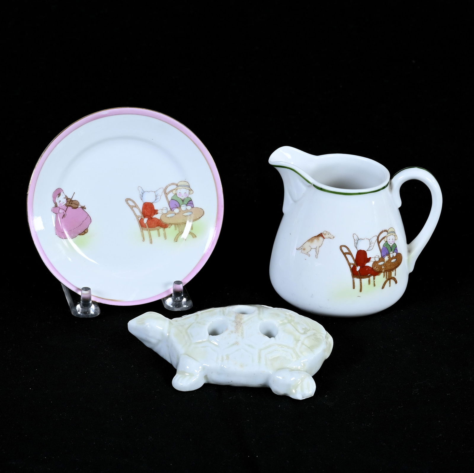 (3) Assorted Items Marked Nippon: (3) Assorted Items Marked Nippon, 3 x 3.75 x 3 Inches, Including (1) Turtle Flower Frog, (1) Child's Creamer With Scenes Of Children And (1) Matching Plate, 1.0 Pounds, Dr. Harold & Audrey Eklund