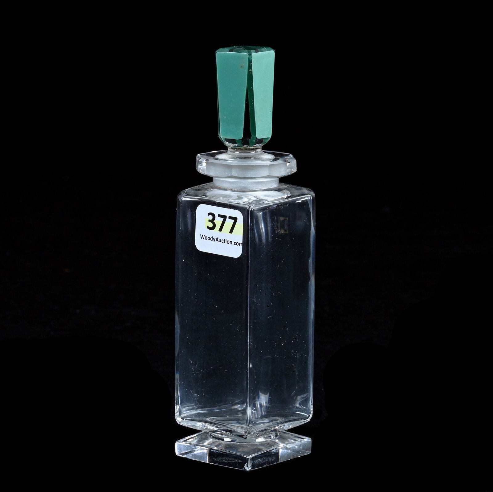 Perfume Bottle, Marked Baccarat, Circa 1927: Perfume Bottle, Marked Baccarat, Circa 1927, 6 x 1.5 x 1.5 Inches, Created For Caron, Clear Vase With Green Stopper, 0.4 Pounds, Hazel Elaine Carlson Estate.