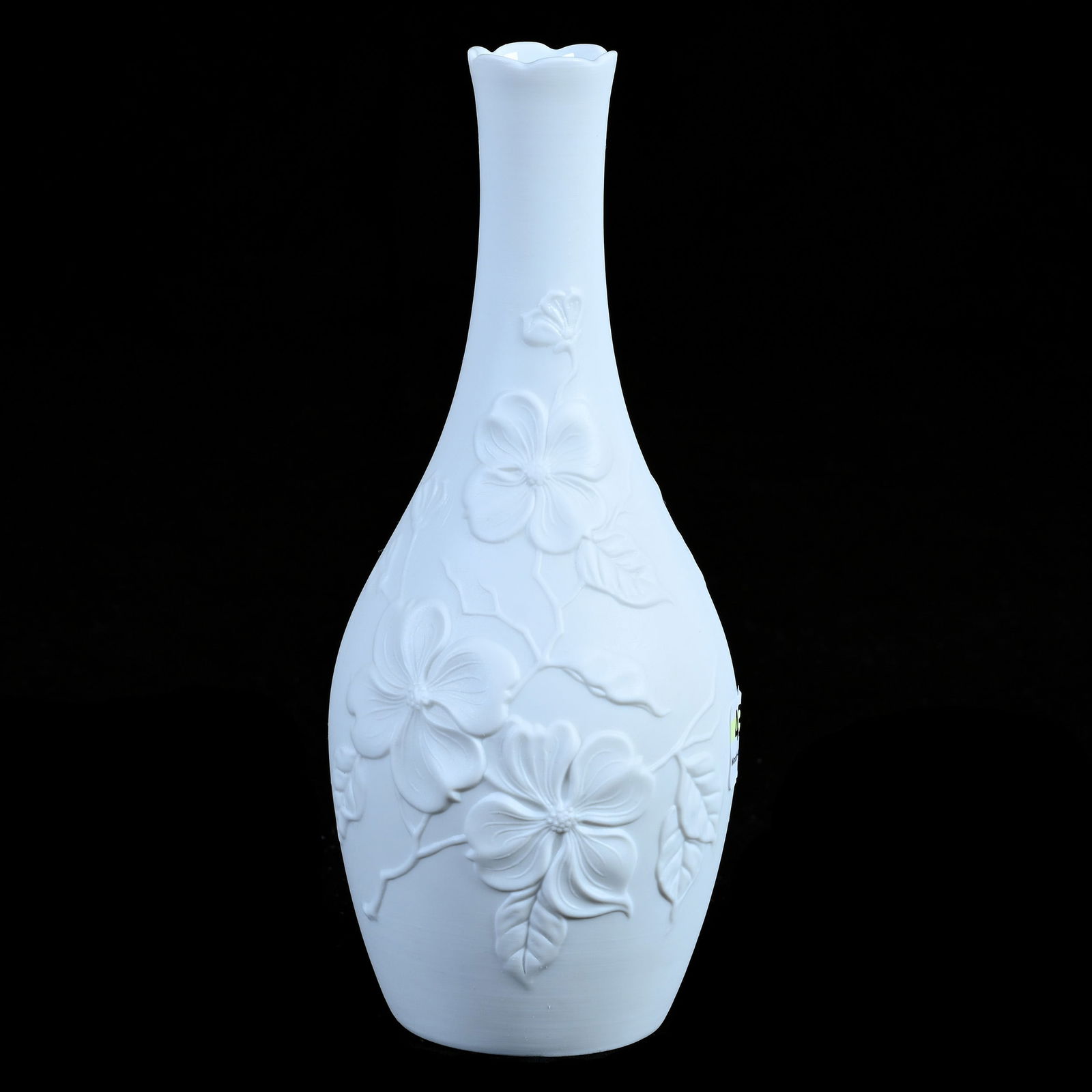 Vase, Marked Kaiser Porcelain, Unglazed White Bisque With Embossed Dogwood Design: Vase, Marked Kaiser Porcelain, Unglazed White Bisque With Embossed Dogwood Design, 7.75 x 3.25 x 3.25 Inches, 0.5 Pounds, Hazel Elaine Carlson Estate.